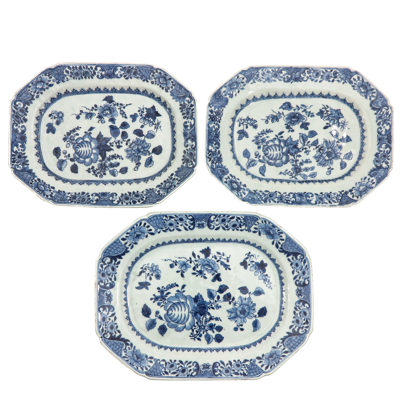 A Group of 3 Blue and White Trays: Floral decors, ca. 1800, 2 trays (28 x 22 cm), larger tray (33 x 25 cm), fritting.
