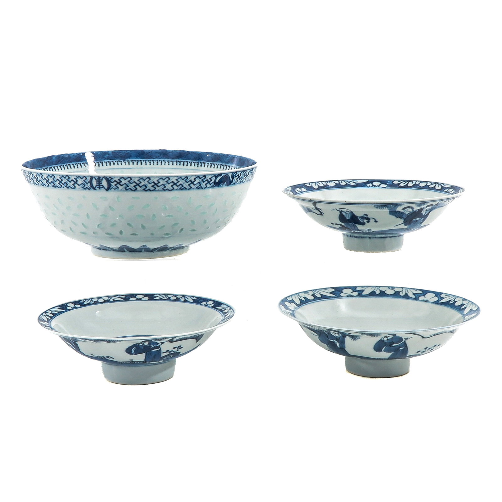 A Group of Blue and White Bowls: In a variety of motifs, including 3 stemmed bowls, largest bowl is 26 cm in diameter, chip.
