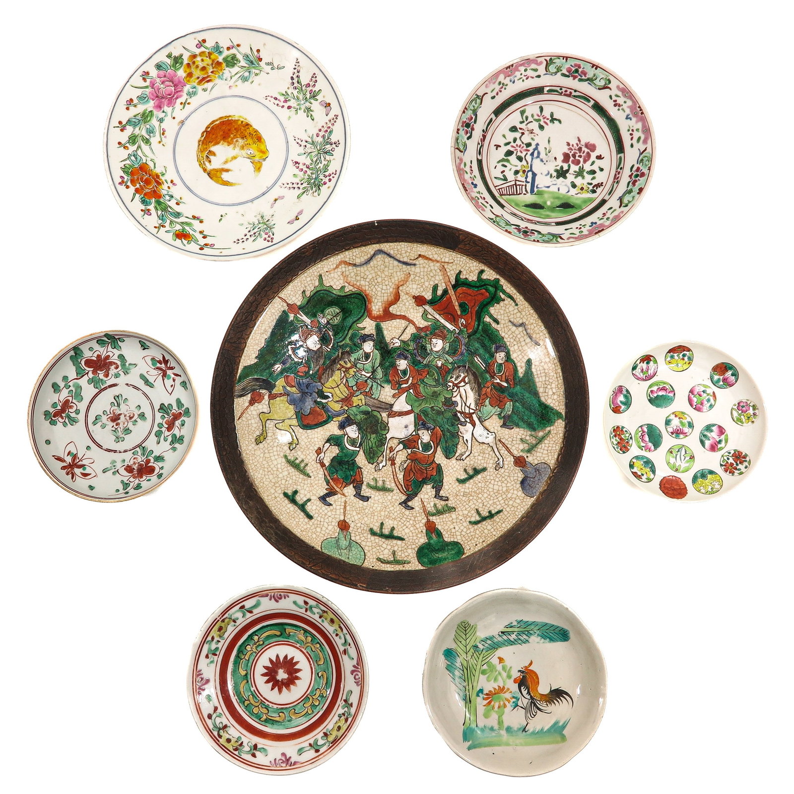 Collection of Porcelain: 7 plates in various sizes and decors of Famile Verte, florals and Nanking, including 19th Century, Nanking charger is 41 cm in diameter.