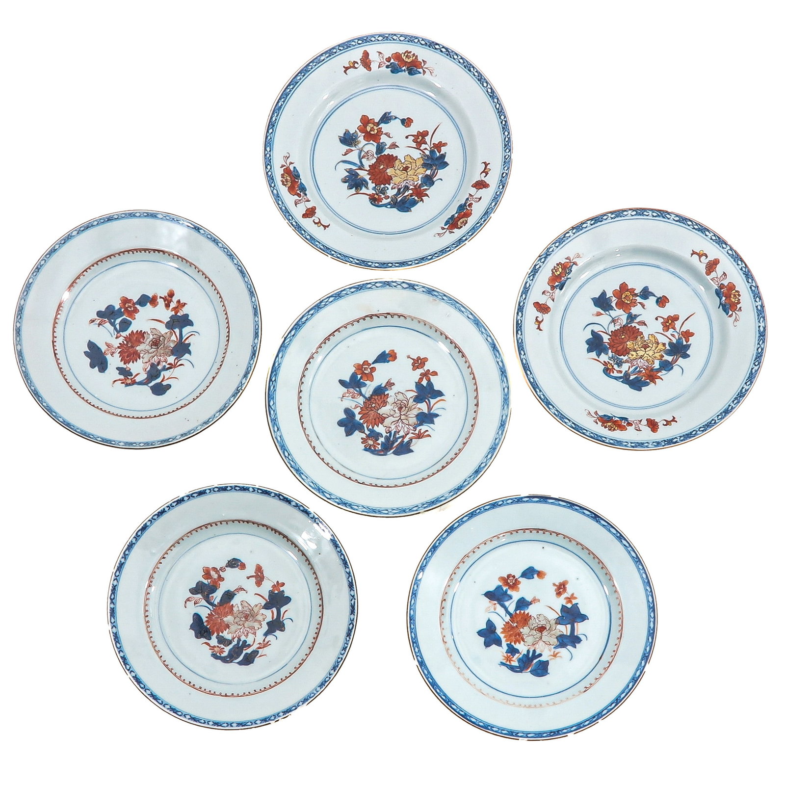 A Group of 6 Imari Plates: Decorated with floral sprays and patterned borders, 18th Century, 23 cm in diameter, chip and hairline.