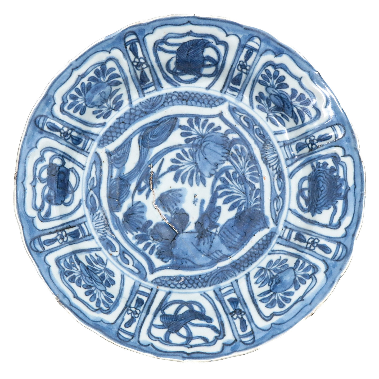 A Wanli Period Plate: Decorated with a central garden scene within a panelled border of alternating motifs, Wanli Period, 22 cm in diameter, fritting.