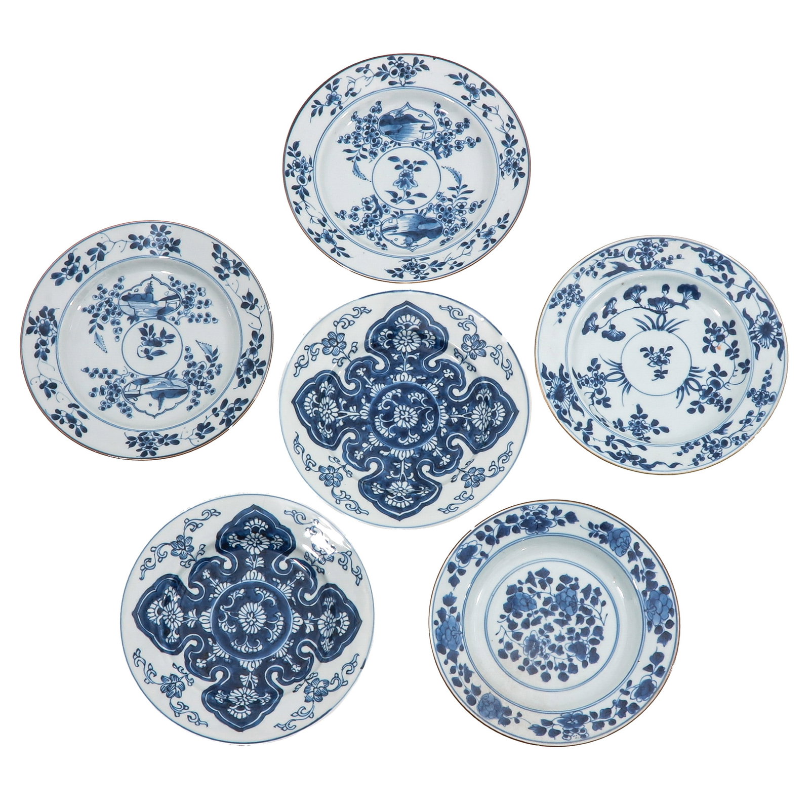A Group of 6 Blue and White Plates: Decorated with floral motifs and garden scenes, 18th Century, largest plate is 22 cm in diameter, chip and hairline.