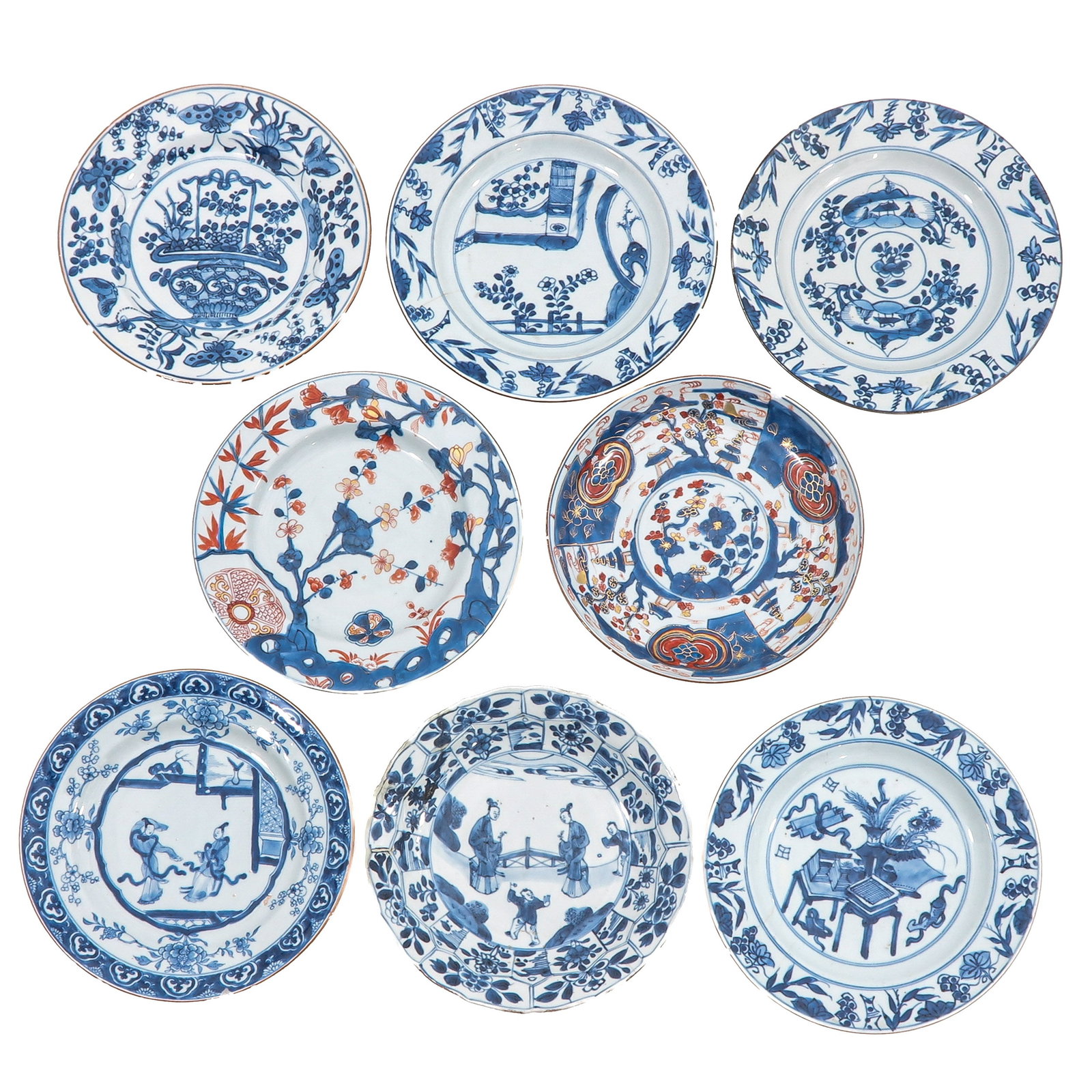 A Group of 8 Plates: In blue and white and Imari examples with decors of flowers, scholars, and garden scenes, 18th Century, largest plate is 23 cm in diameter, in diverse conditions.