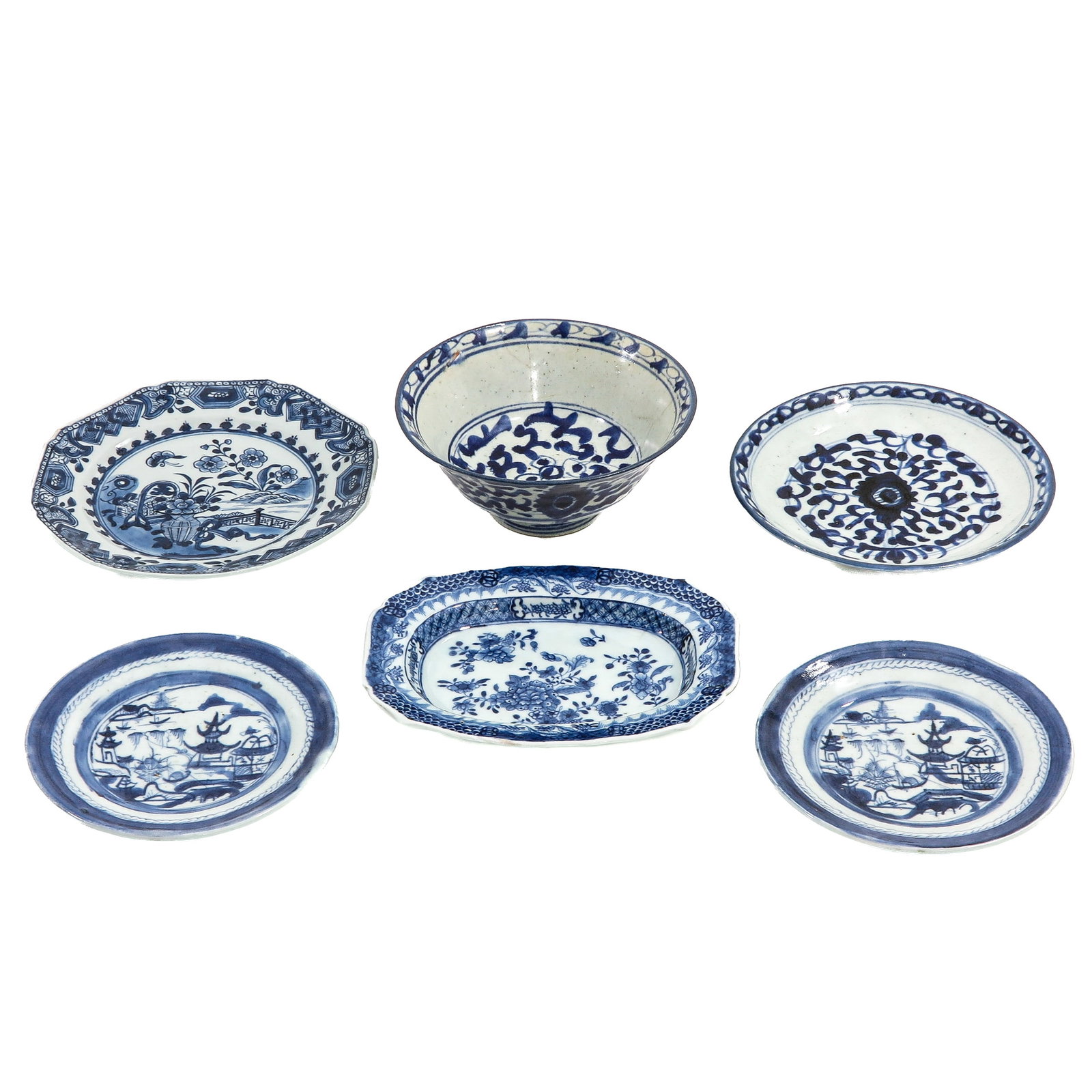 A Group of Porcelain: Comprising various plates, bowls, and a serving dish, decorated with floral and landscape scenes, including Qianlong Period, in diverse conditions.