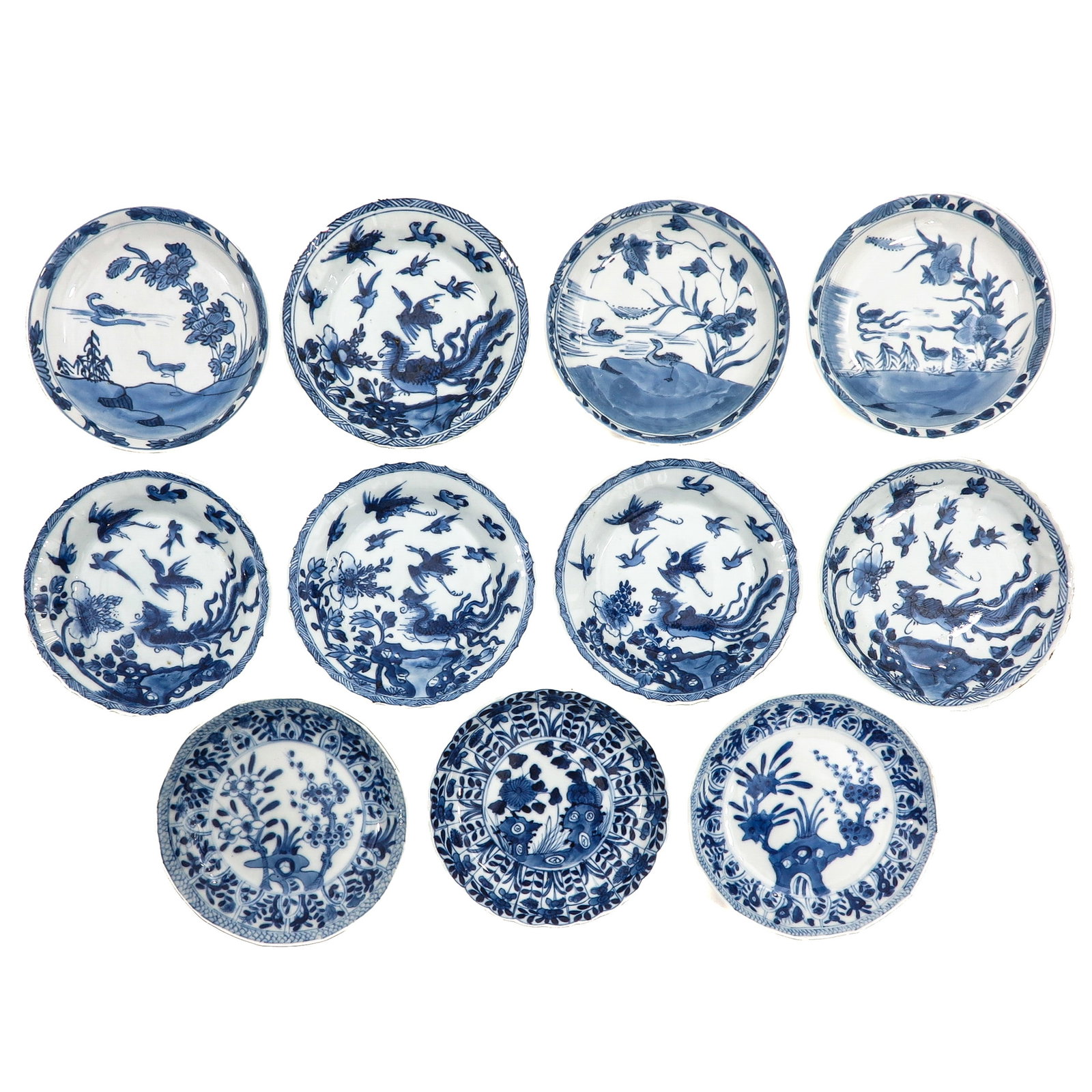 A Group of Blue and White Saucers: In a variety of decors, including 18th Century, largest saucer is 14 cm in diameter, chip and hairline.