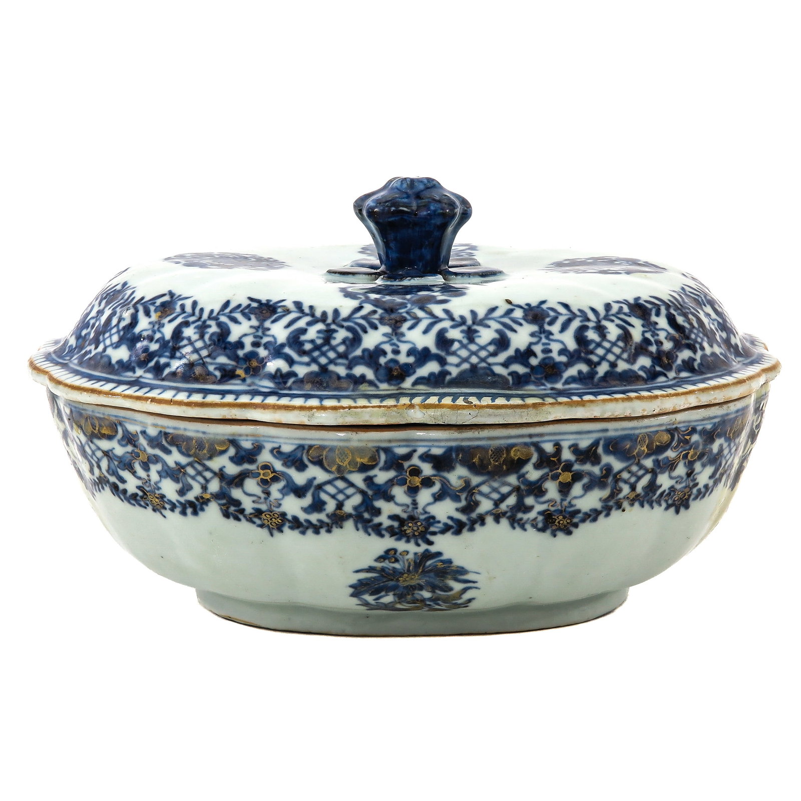 An Oval Tureen with Cover: Decorated with scrolling motifs and gilt accents, the domed cover with finial, Qianlong Period, 25 cm long, small restoration to the rim of the cover.
