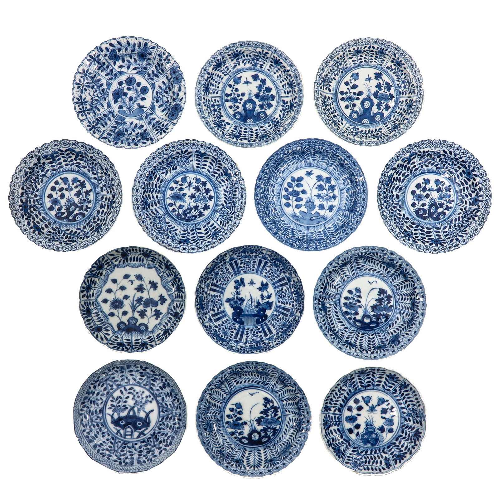 A Group of Blue and White Saucers: In a variety of decors, including 18th Century, largest saucer is 13 cm in diameter, chip and hairline.