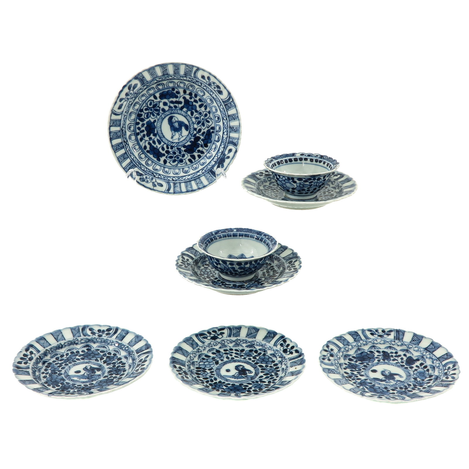 A Group of Cups and Saucers: Including 2 cups and 6 saucers, decorated with floral motifs and central medallions depicting young boys, 18th Century, saucers are 13 cm in diameter, chip and hairline.