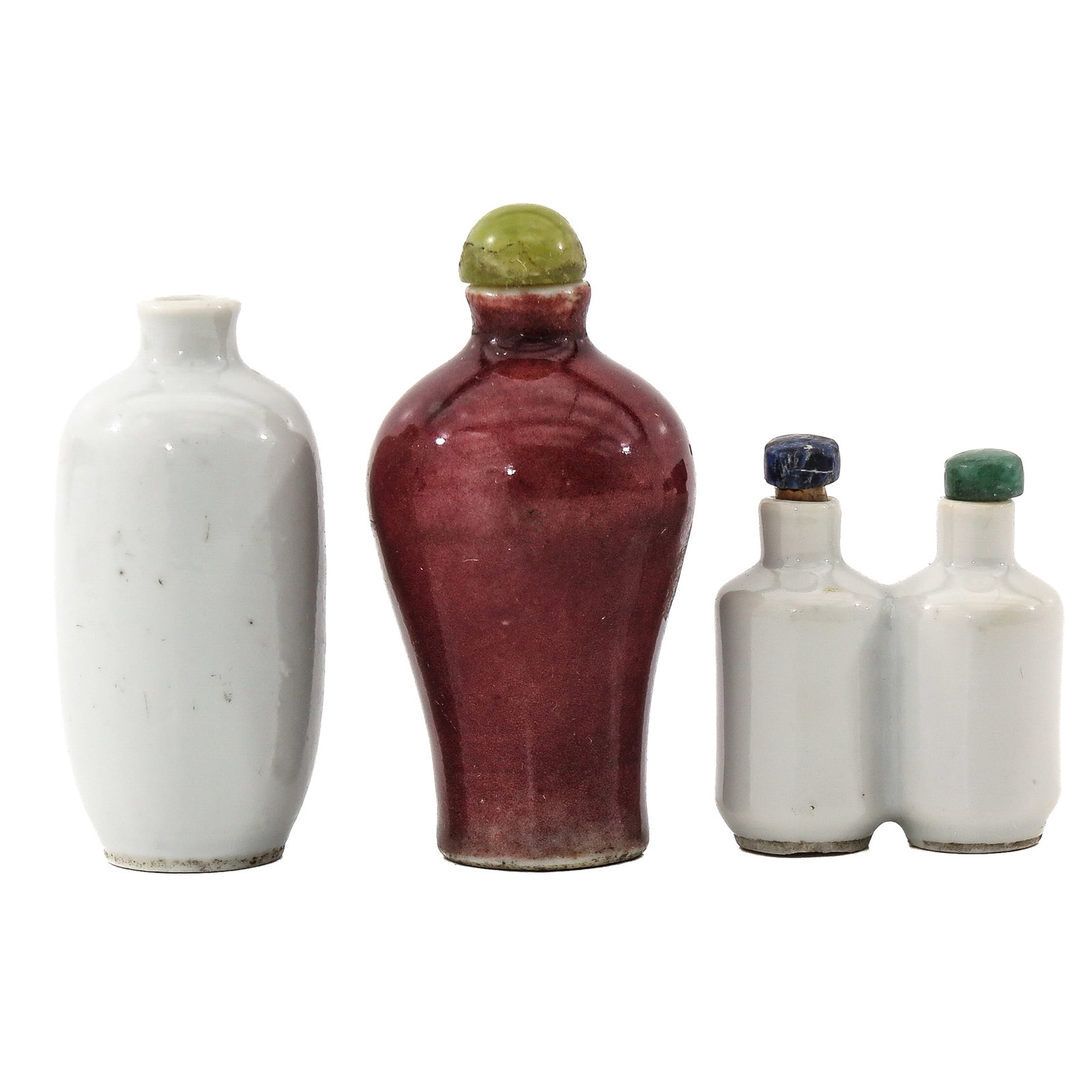 A Group of 3 Porcelain Snuff Bottles: Including sang-de-boeuf glaze, a white glaze, and a double bottle model, tallest bottle is 8 cm