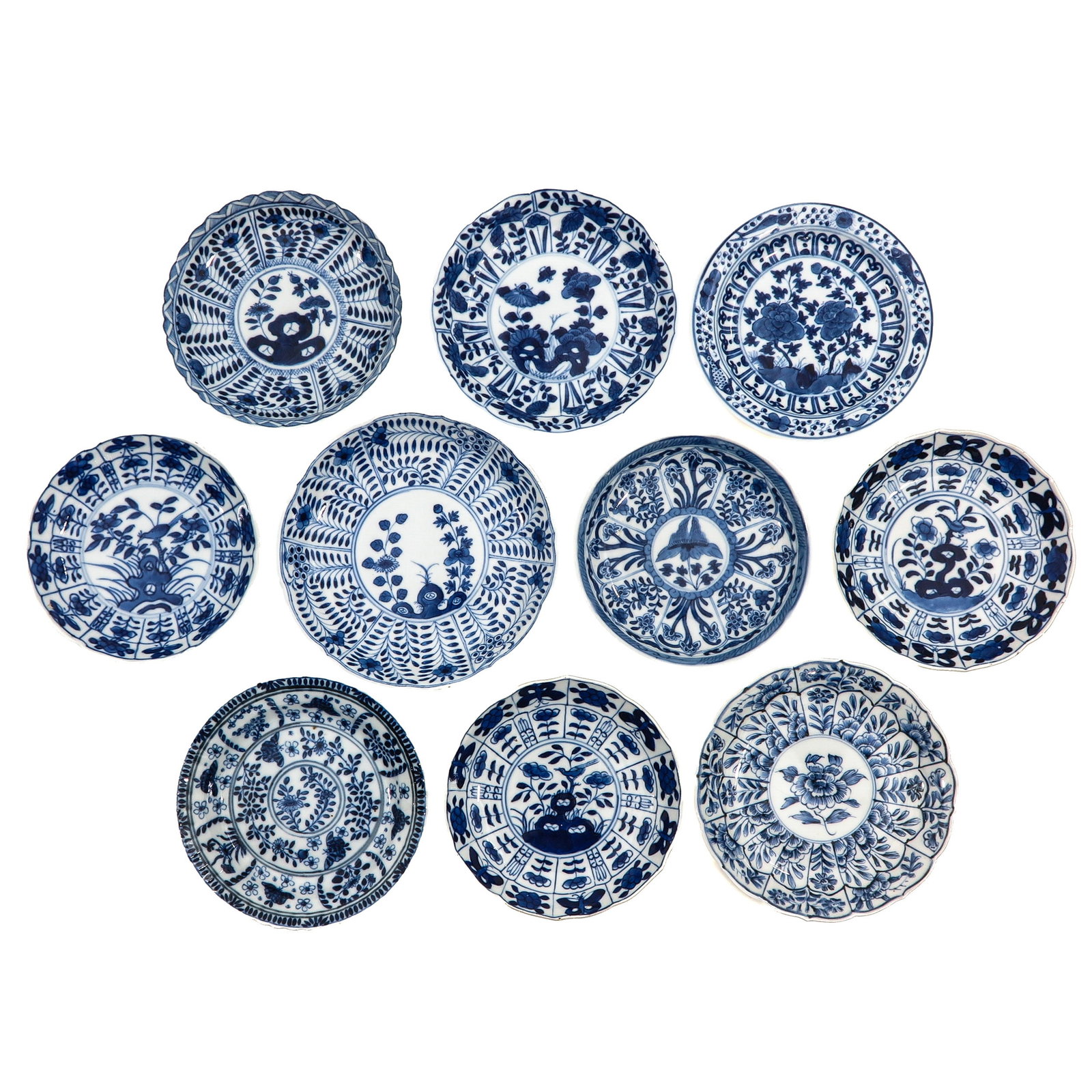 A Group of Blue and White Saucers: In a variety of decors, including 18th Century, largest saucer is 15 cm in diameter, chip and hairline.