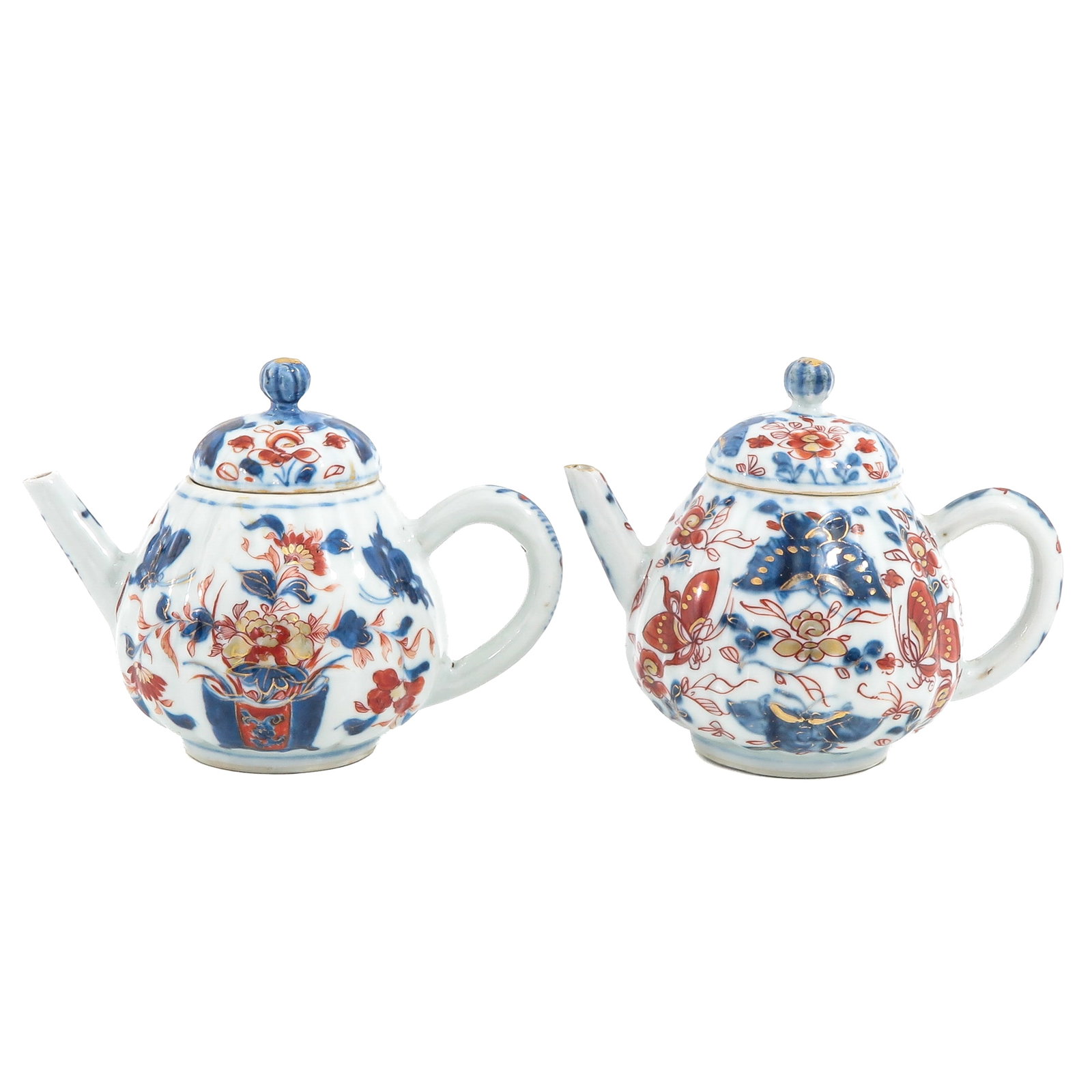 A Lot of 2 Teapots: Decorated in blue and iron-red with gilt highlights of butterflies and flowering plants, 18th Century, 12 cm tall.