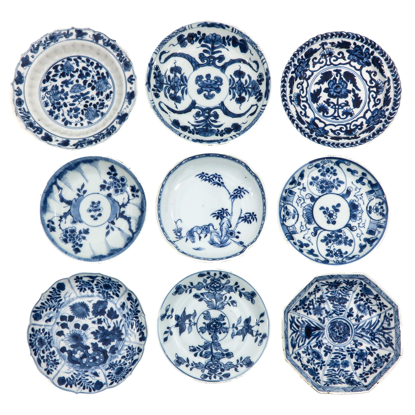 A Group of Blue and White Saucers: In a variety of decors, including 18th Century, largest saucer is 14 cm in diameter, chip.