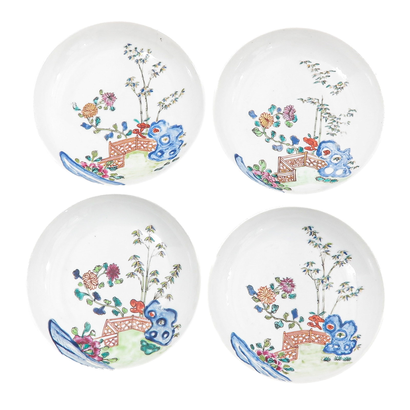 A Set of 4 Small Famille Rose Plates: Decorated with a garden landscape with a bridge and flowers, 15 cm in diameter, hairline.