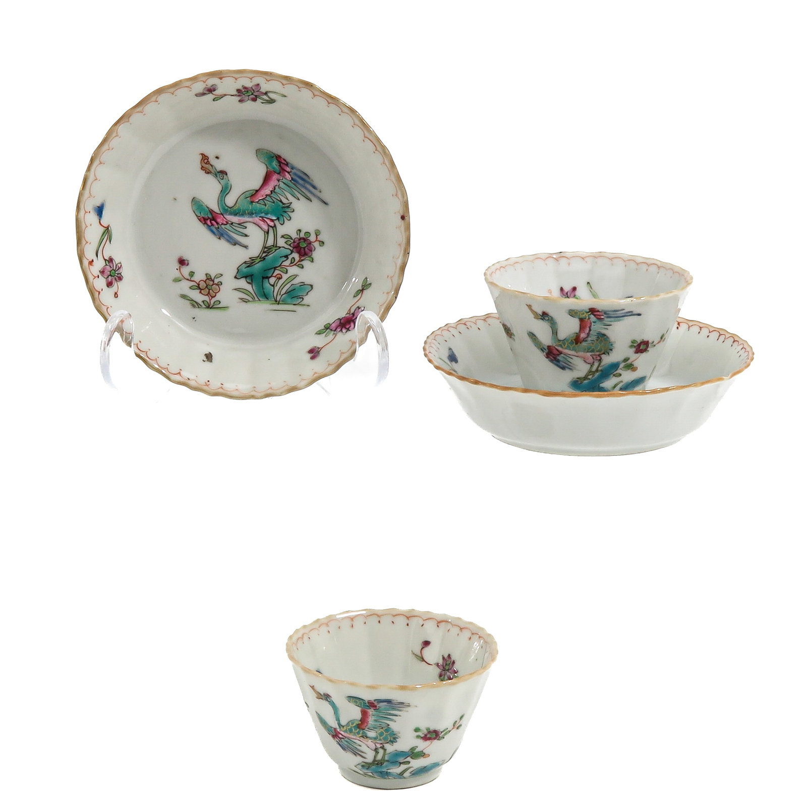 A Pair of Cups and Saucers: Famille Rose enamels decorated with flowers and birds, Yongzheng Period, saucers are 11 cm