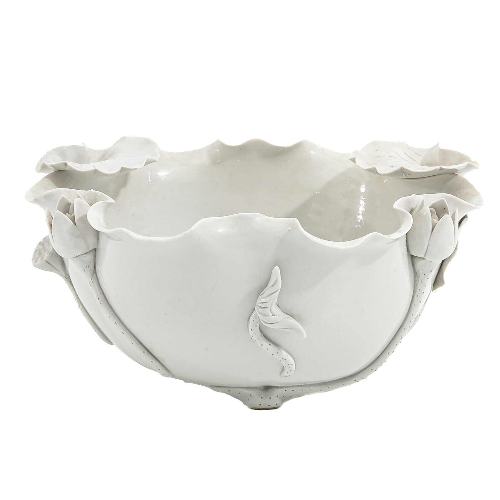 A Blanc de Chine Bowl: In the form of a lotus, with applied leaf and flower decor, 19th Century, 21 cm in diameter.