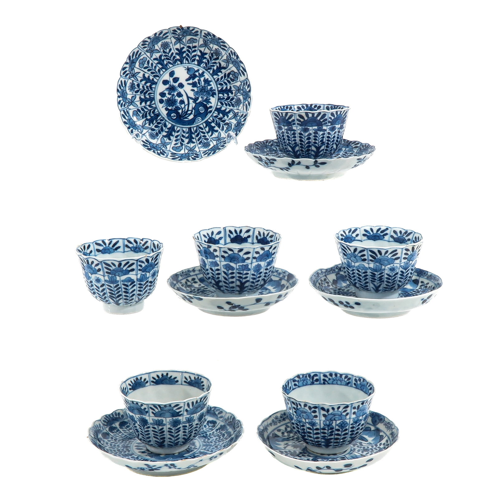 A Set of 6 Blue and White Cups and Saucers: Parsley decor, including 18th Century, saucers are 13 cm in diameter, chip and hairline.