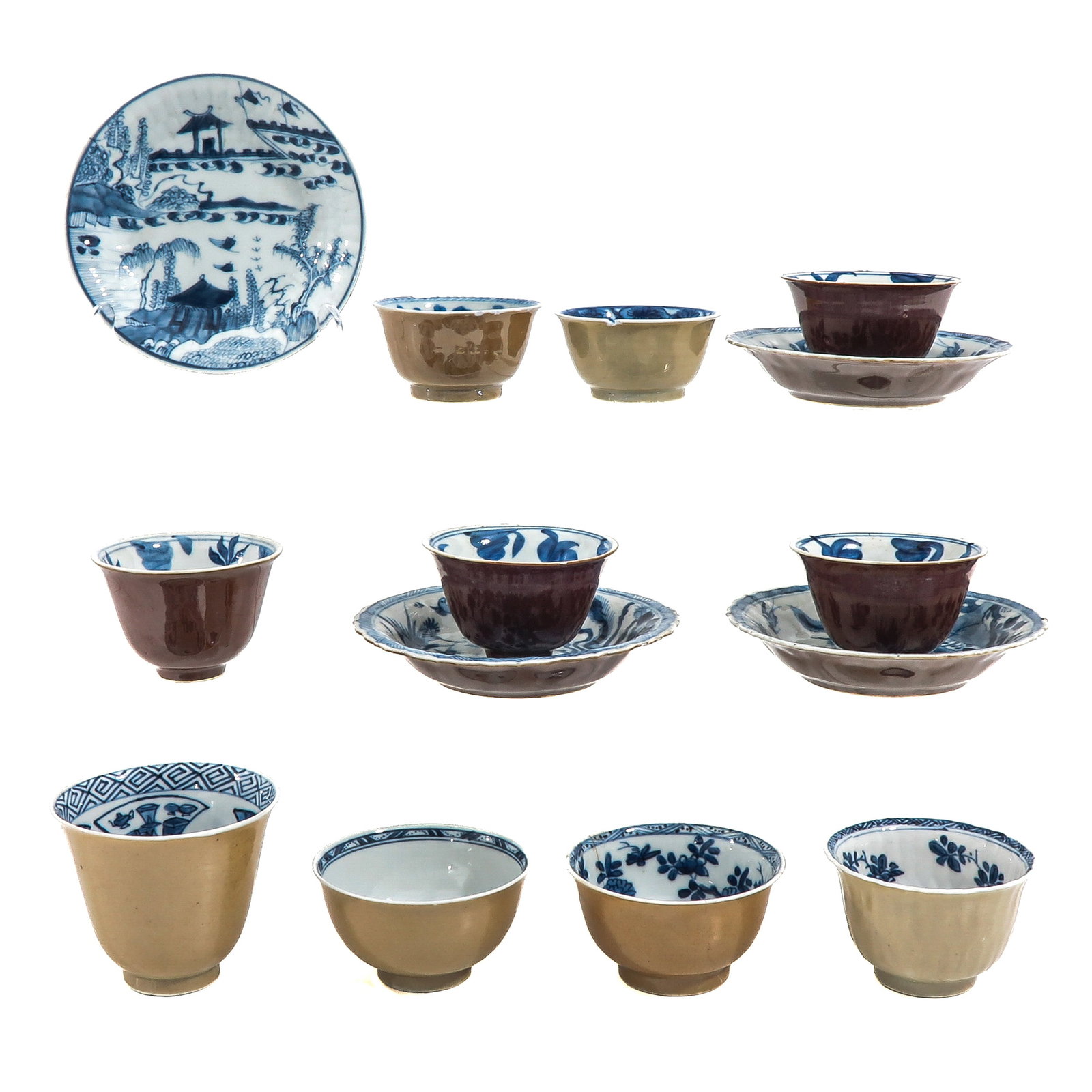 A Group of Cups and Saucers: Batavianware with blue decors of landscapes, 18th Century, saucers are 13 cm in diameter, in diverse conditions.