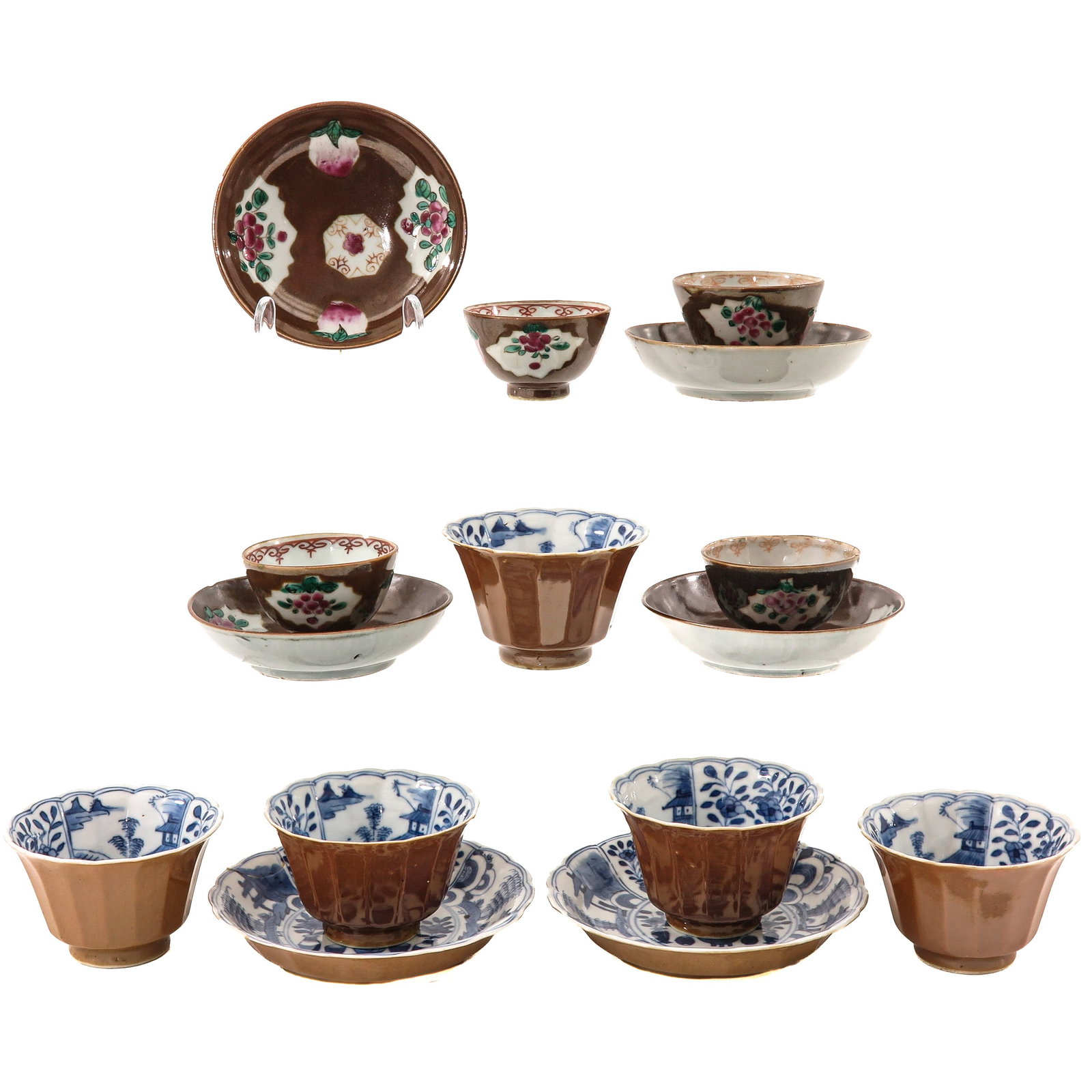 A Group of Cups and Saucers: 18th - 19th Century, including Batavianware and Famille Rose decors, largest saucers are 13 cm in diameter, in diverse conditions.