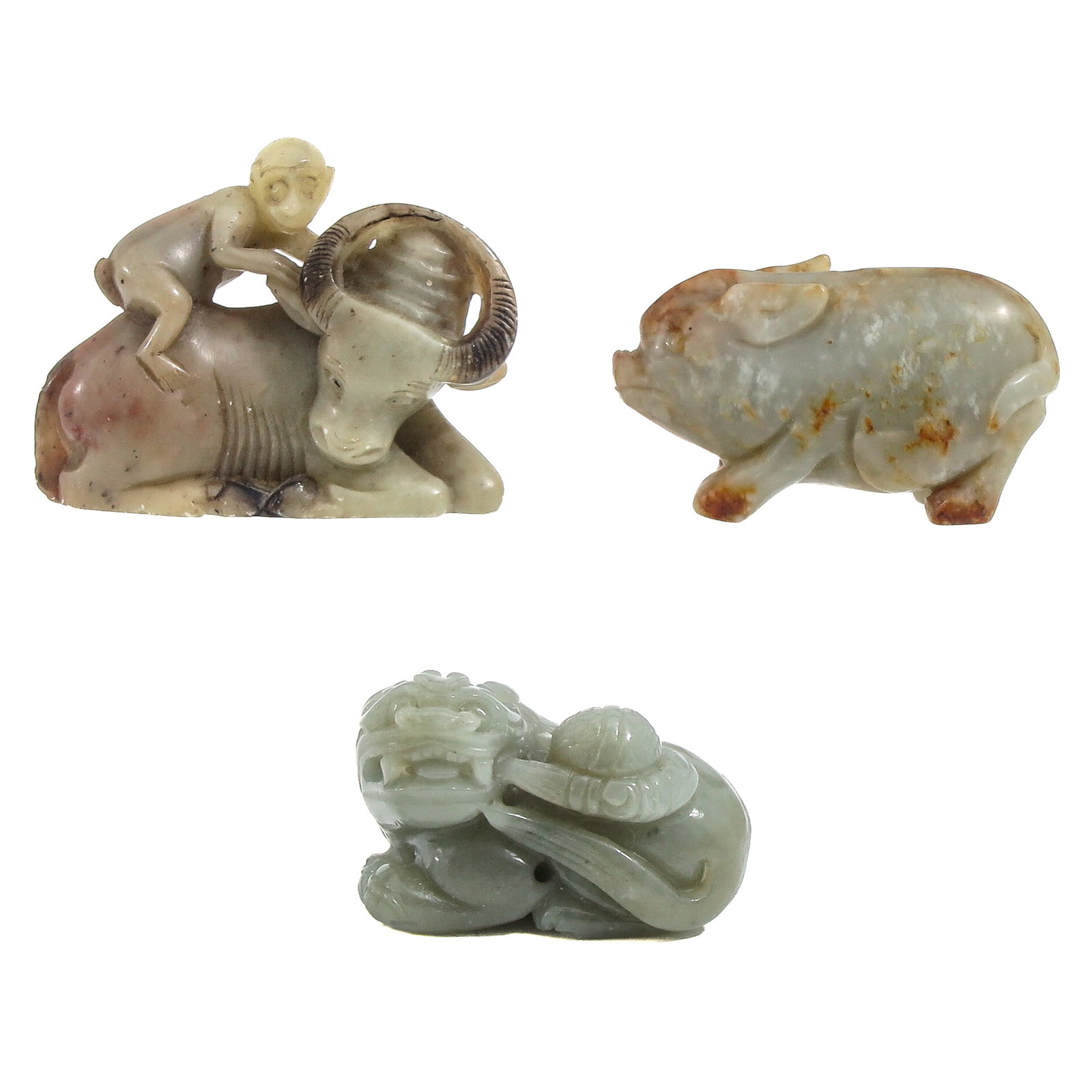 A Group of 3 Carved Sculptures: Including a water buffalo, temple lion, and a pig, largest is 7 cm long.
