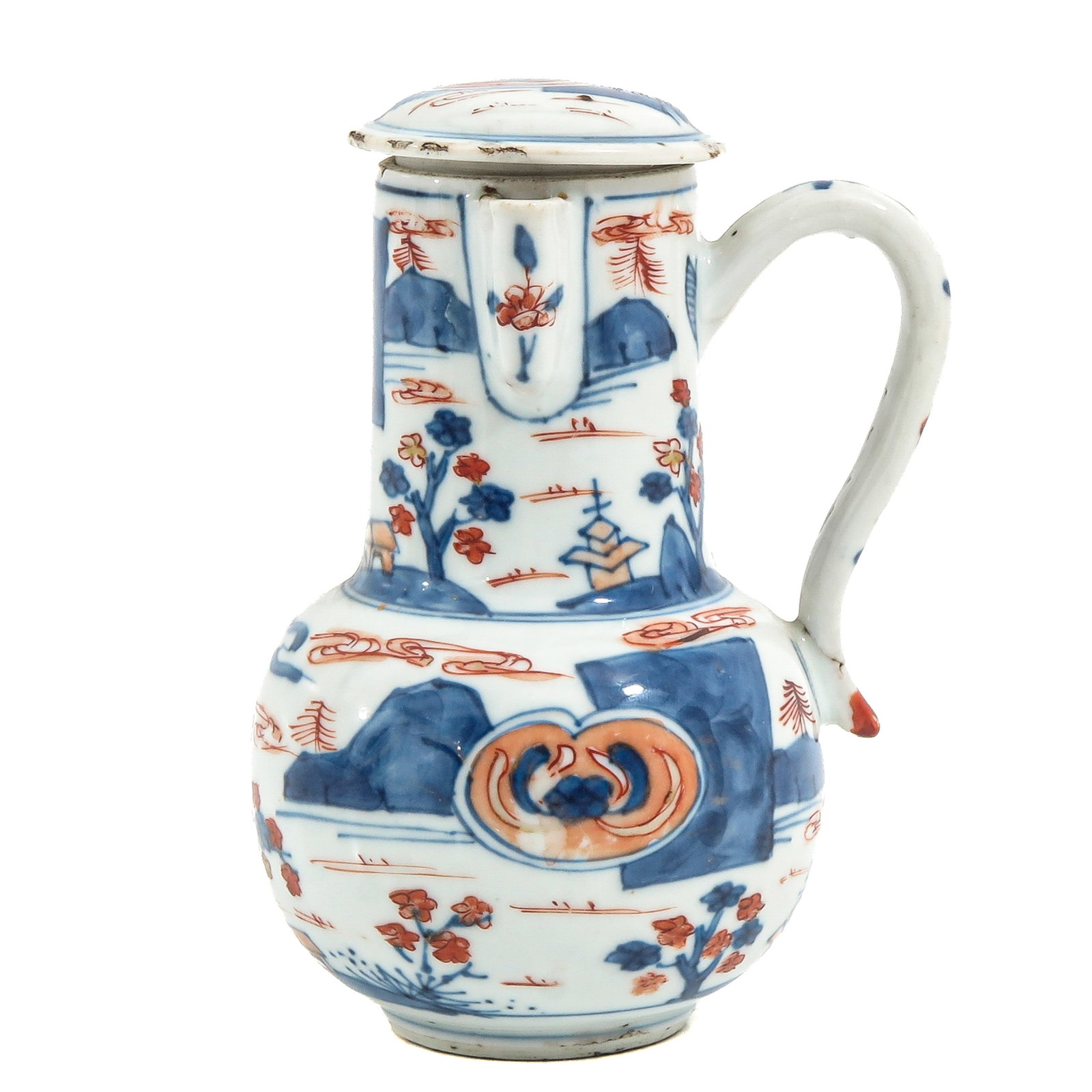 An Imari Covered Creamer: Depicting landscapes in iron red and blue enamels, 18th Century, 15 cm tall, chip, baking fault on handle.