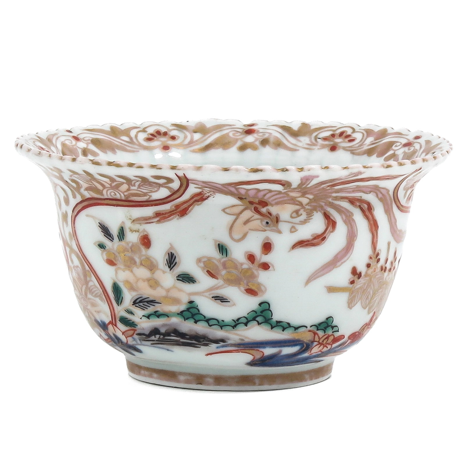 A Small Polychrome Decor Bowl: Milk and Blood palette with a phoenix among flowering plants, with lobed rim, 11 cm in diameter.