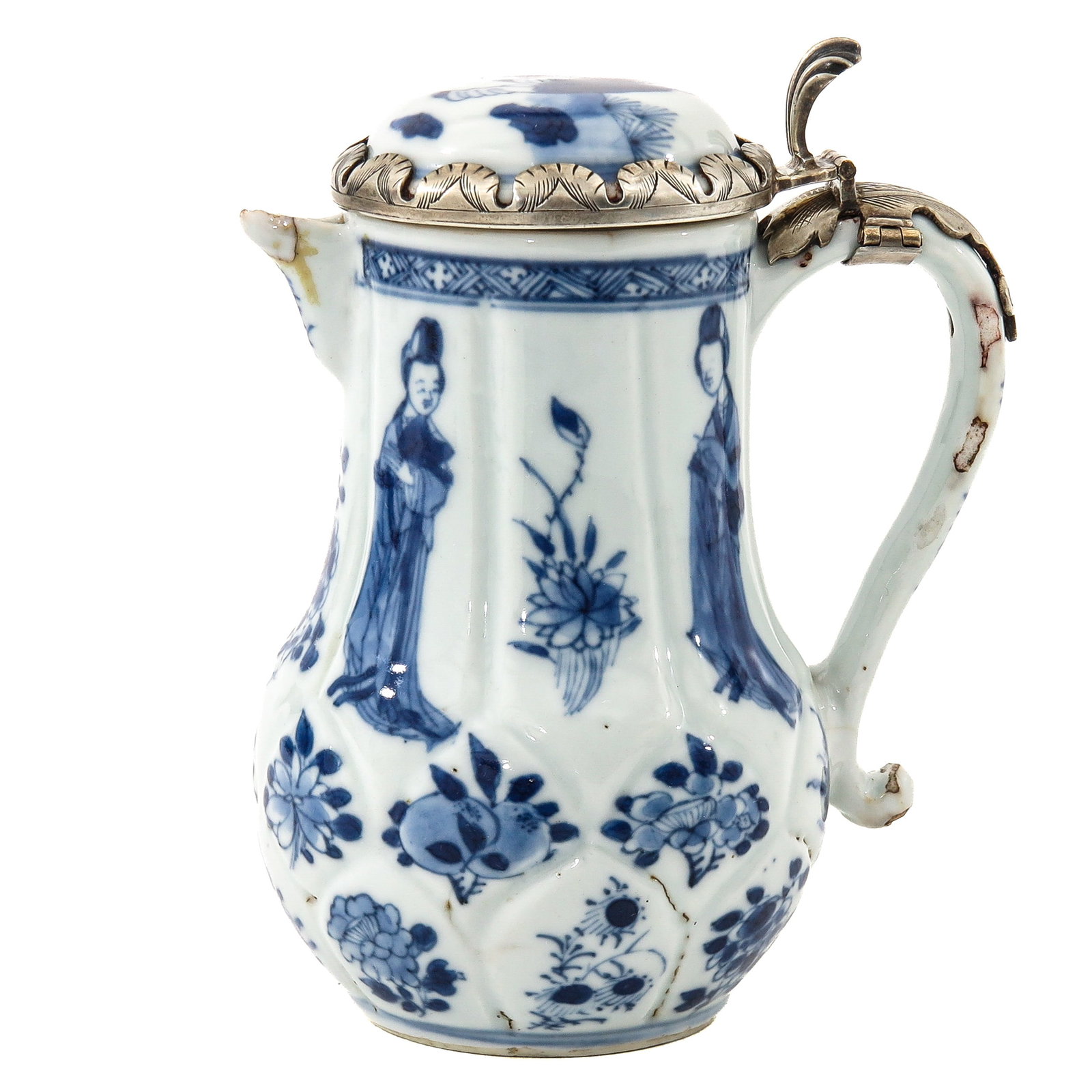 A Blue and White Jug: Decorated with alternating scenes of flowers and Chinese ladies, with silver mounting, Kangxi Period, 13 cm tall, in diverse conditions.