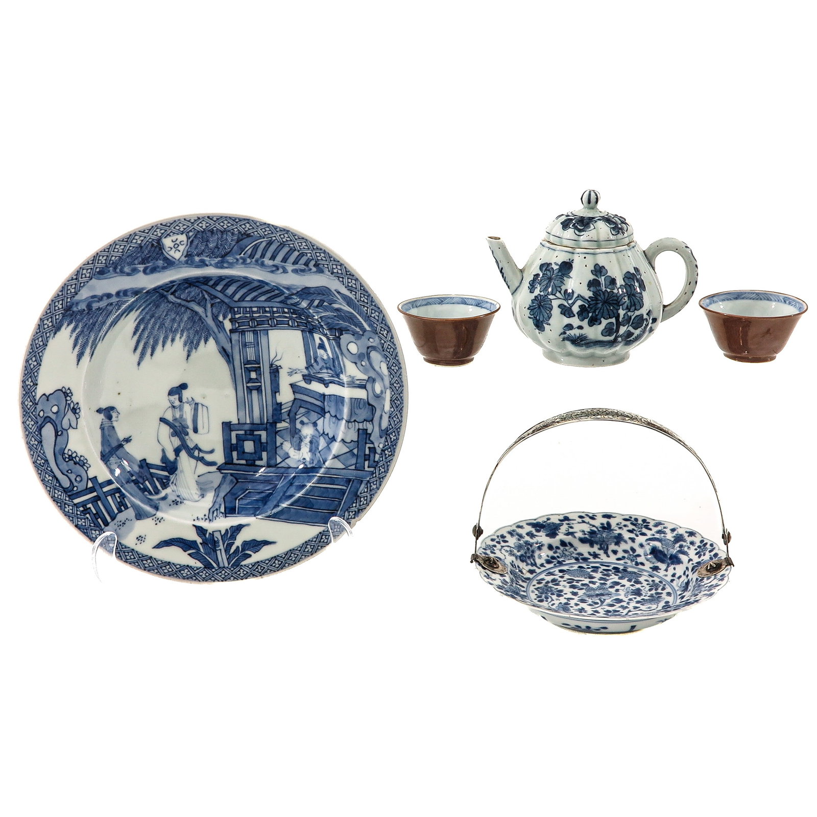 A Collection of Porcelain: A variety of items including teacups, teapot, Kangxi Period small dish with silver handle and a plate, teapot is 10 cm tall, in diverse conditions.