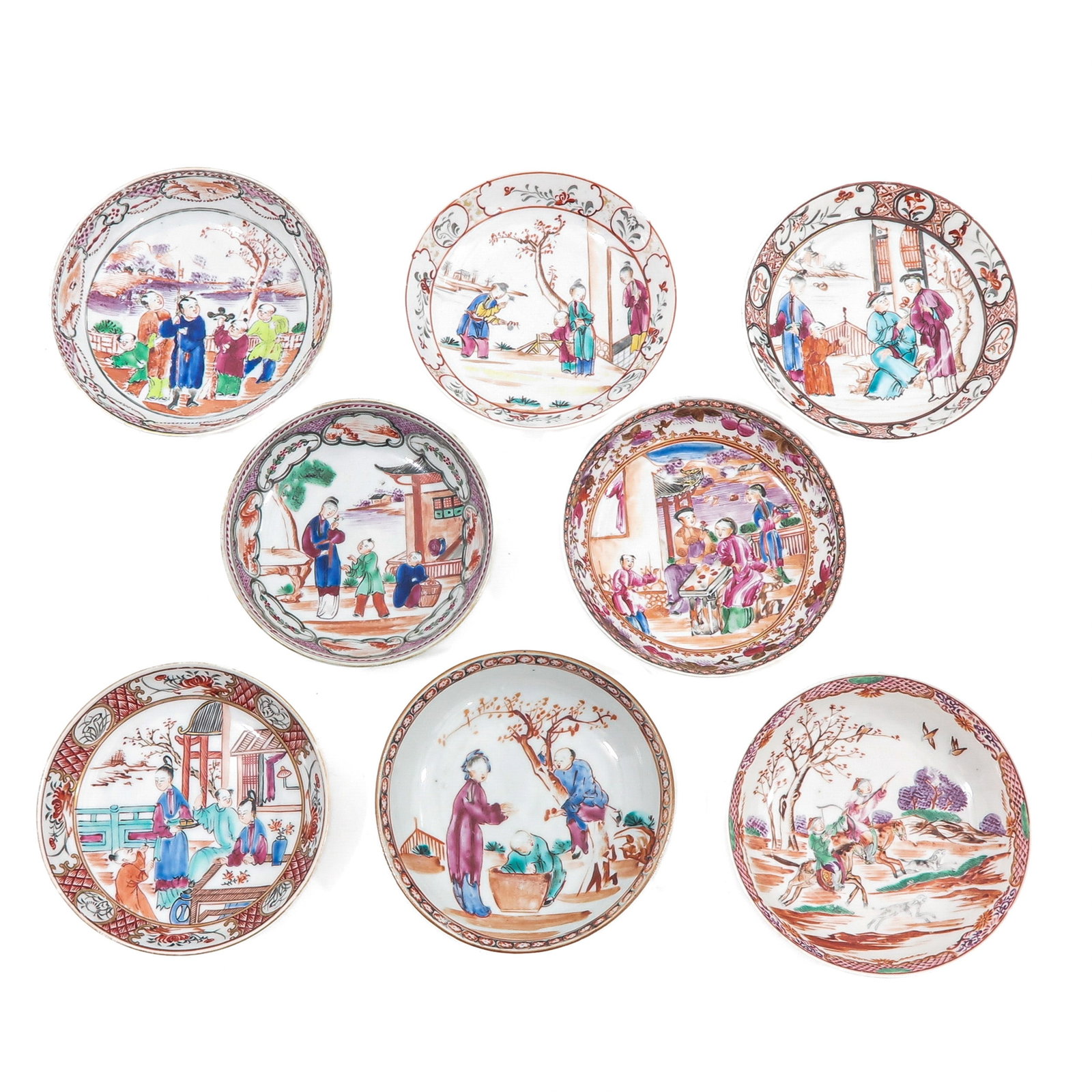 A Group of Mandarin Decor Saucers: Decorated with figures in garden and interior scenes, 18th Century, largest saucer is 12 cm in diameter, chip and hairline.