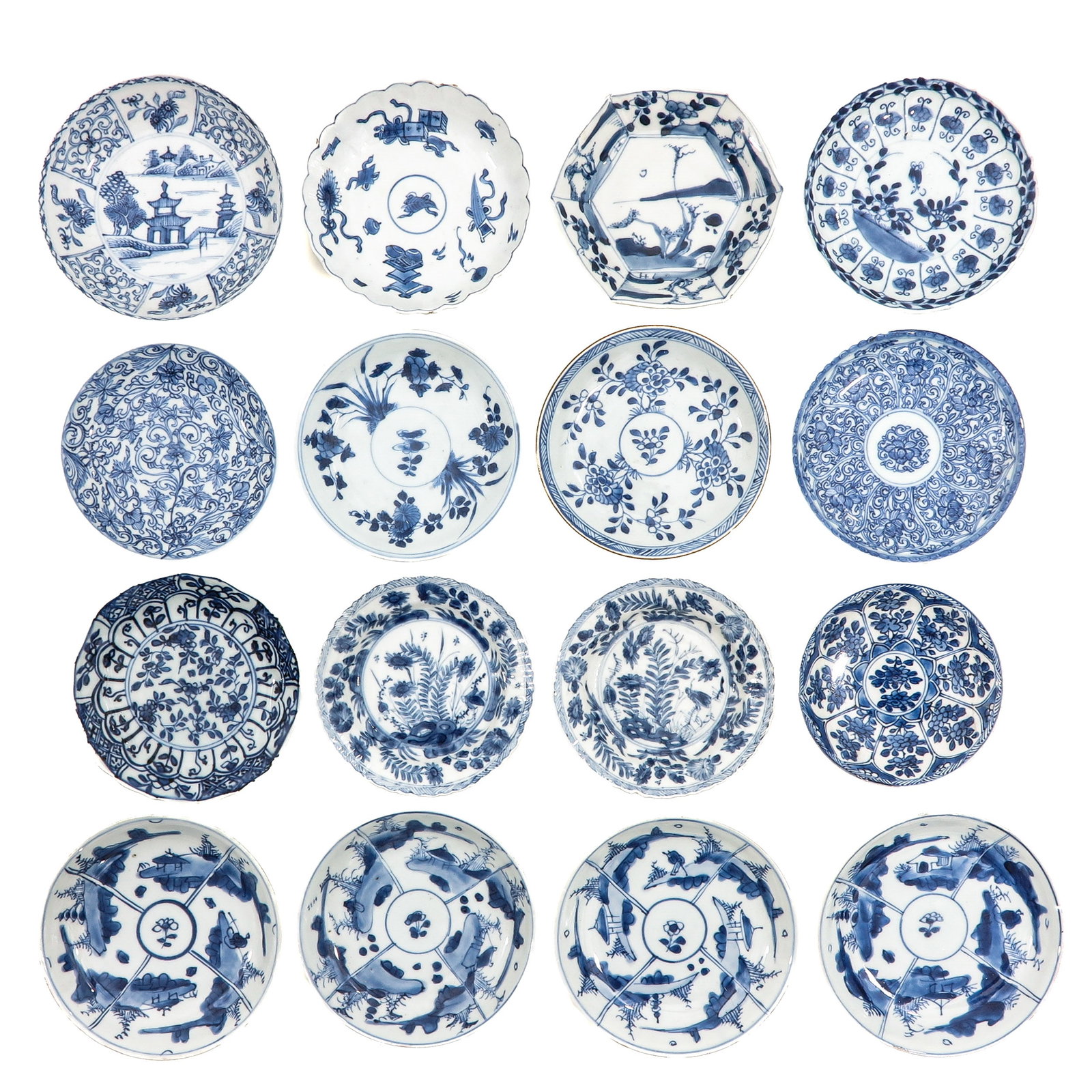 A Large Group of Blue and White Saucers: Decorated with landscapes, floral motifs and panel designs, including 18th Century, largest saucers are 12 cm in diameter, in diverse conditions.