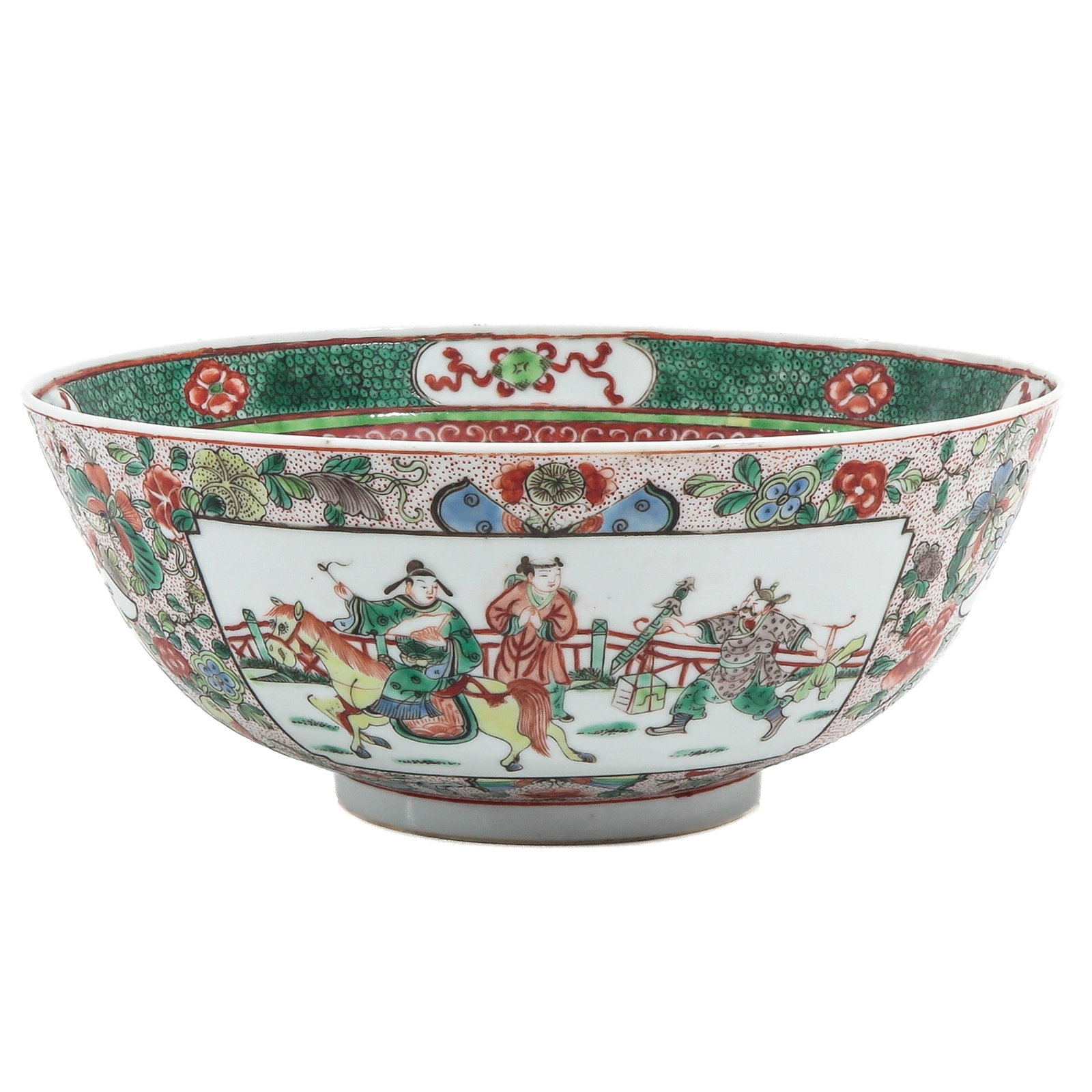 A Famille Verte Bowl: Decorated with a continuous scene of figures in an interior and garden setting, 18th / 19th century. 23 cm in diameter, chip