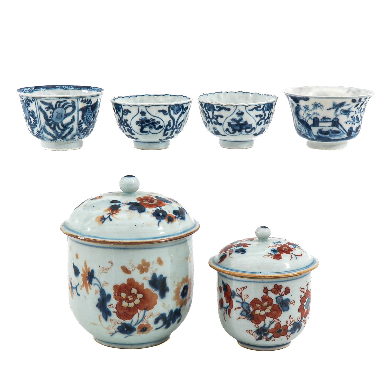A Group of Porcelain: Including blue and white cups and two covered Imari pots, 18th Century, tallest pot is 14 cm, chip and hairline.