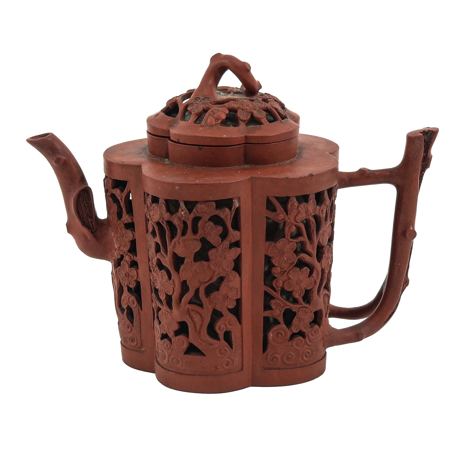 A Yixing Teapot: Openwork floral decor and bamboo-form handle and spout, 15 cm tall.