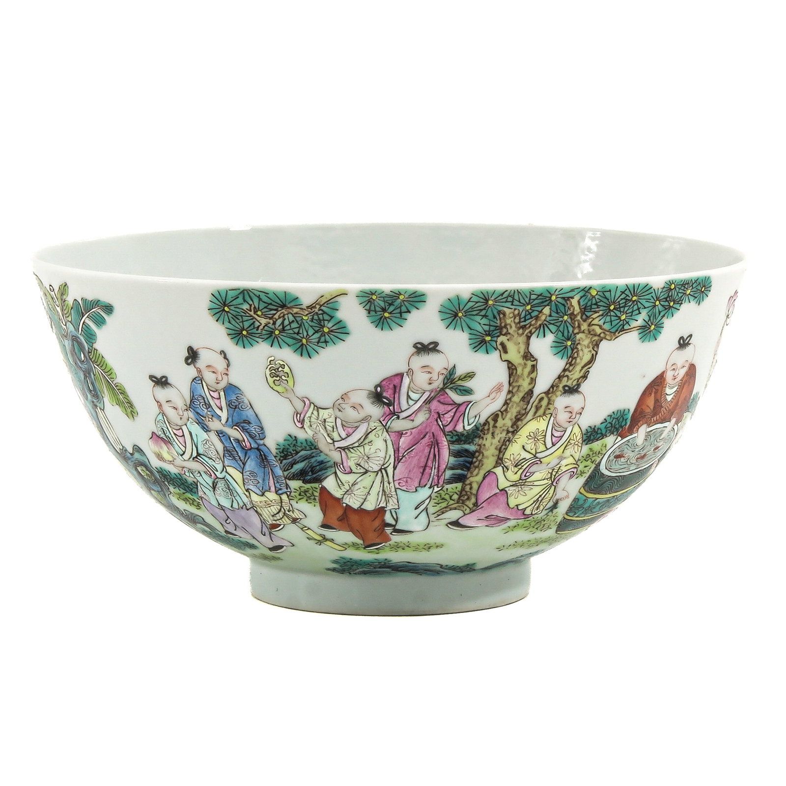 A Famille Rose Bowl: Decorated with playing children in a garden landscape, 17 cm in diameter.