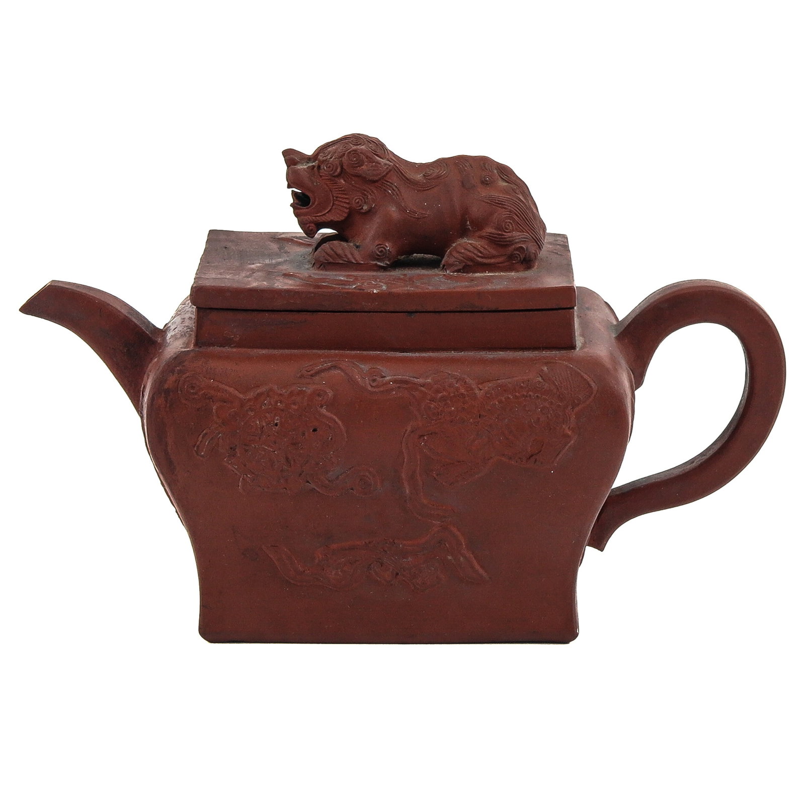 A Yixing Teapot: Relief decor and lid mounted with a temple lion, 11 cm tall.