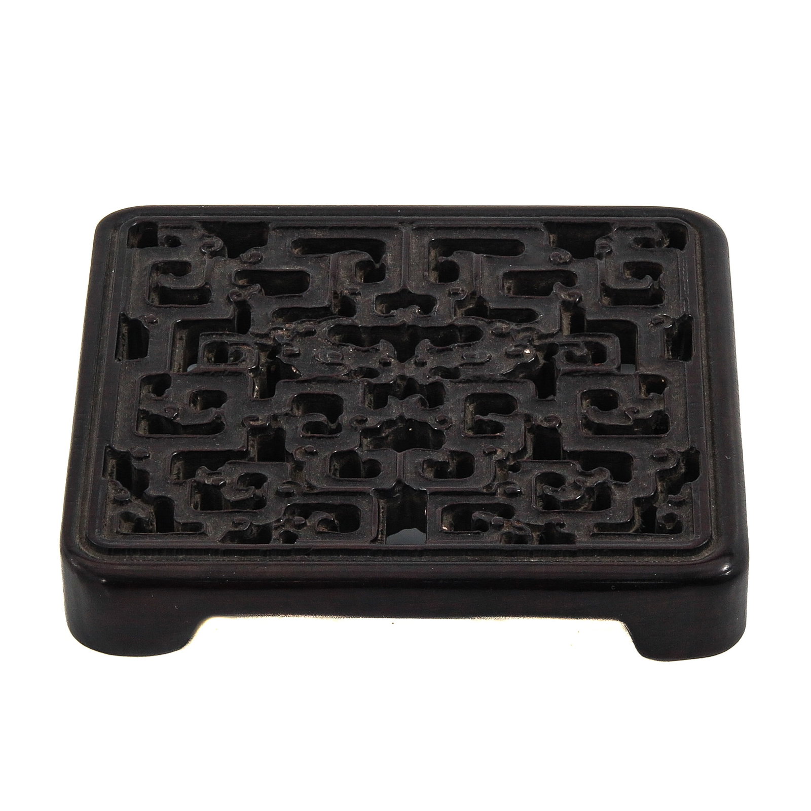 A Carved Wood Incense Holder: Openwork with geometric design on 4 raised short fee, 9 x 2 x 8 cm