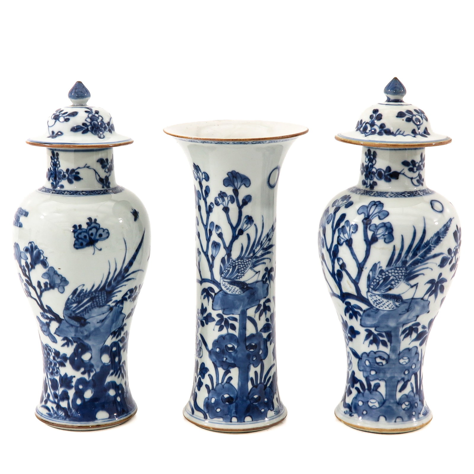 A 3 Piece Blue and White Garniture Set: Depicting a garden scene, vases are 24 - 28 cm tall, chip and hairline.