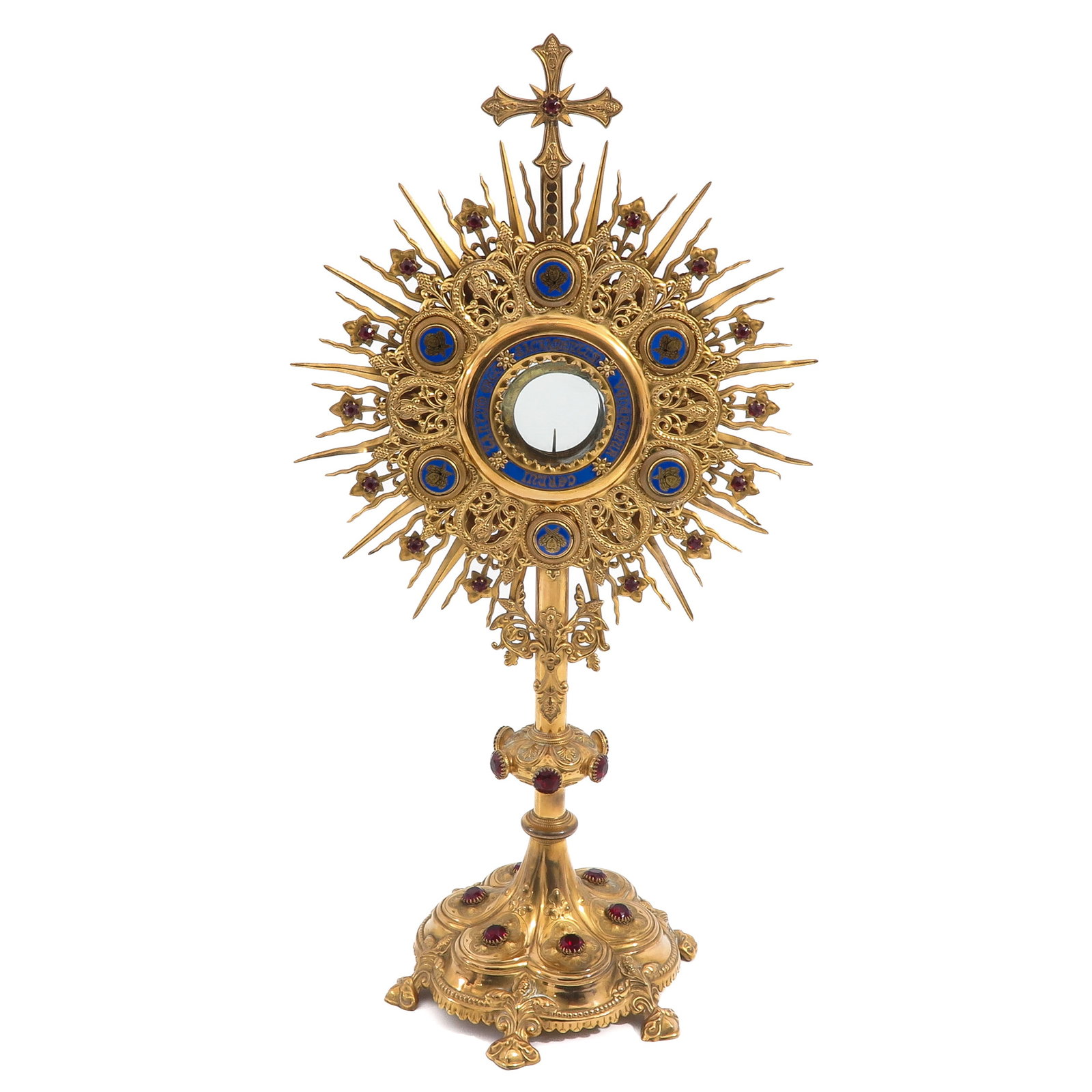 A 19th Century Fine Monstrance Set with Enamel Plaques: decorated with six enamel plaques and enamel surrounding the luna, set with red stones and crowned by a cross, 19th century, height 63 cm