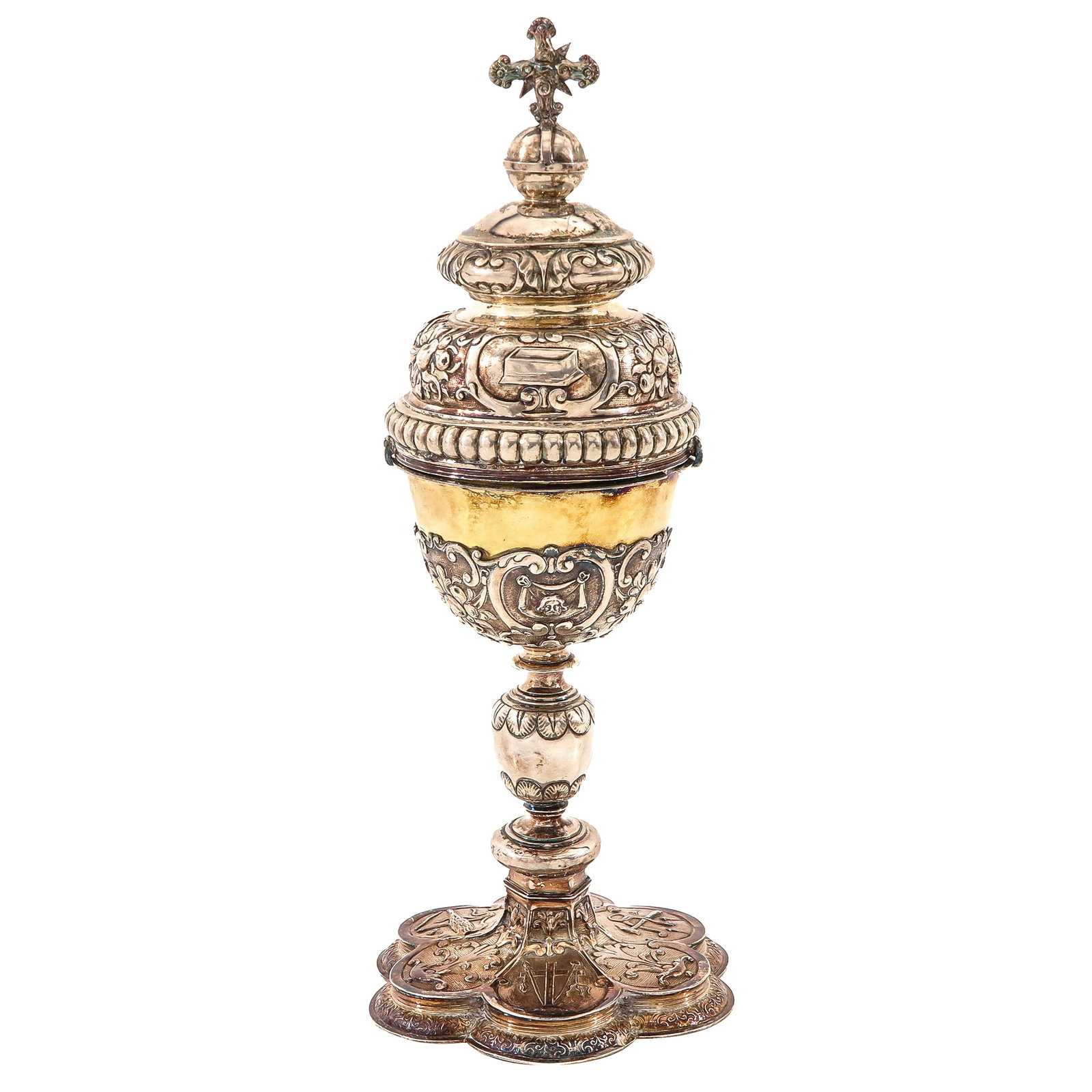 A 17th Century Solid Silver Ciborium: 17th century, solid silver with remnants of gilding, the lid crowned with a cross, richly decorated, possibly Sint Truiden, ca. 1620, height 35 cm