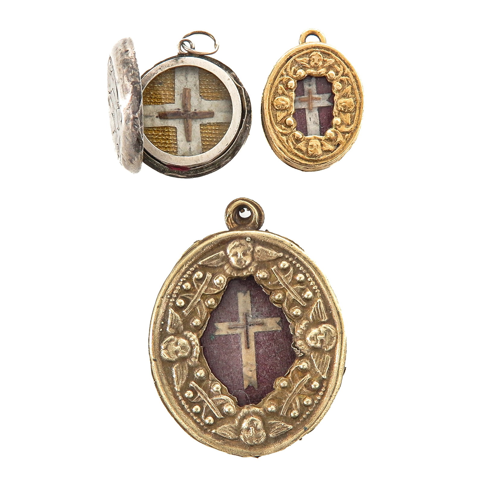 A Group of Thecae: consisting of 3 thecae, each with a relic of the Holy Cross, largest 3.5 cm., you are purchasing the thecae, the relics are a gift