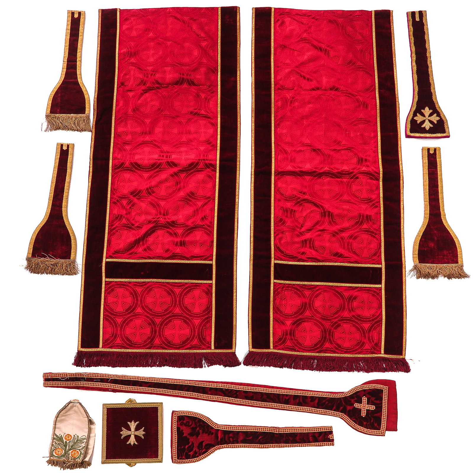 A Group of Liiturgical Vestments: consisting of 2 chalice veils, 5 maniples, a stole, a ciborium veil, and a bursa, executed in red velvet with rich embroidery, 19th century