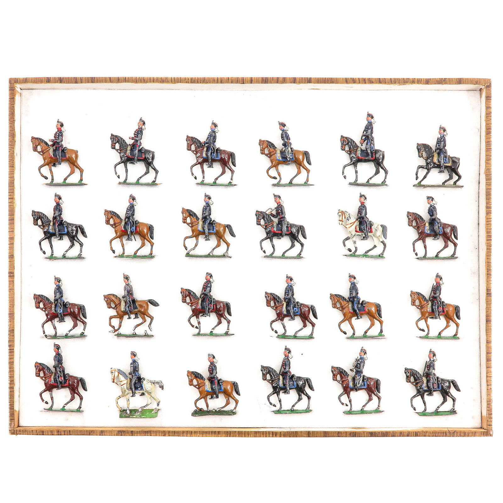 A Collection of Toy Soldiers: of 24 toy soldiers with riders on horseback, Germany, in original box, height figures 6 cm., dimensions box, 47 x 3 x 36 cm.