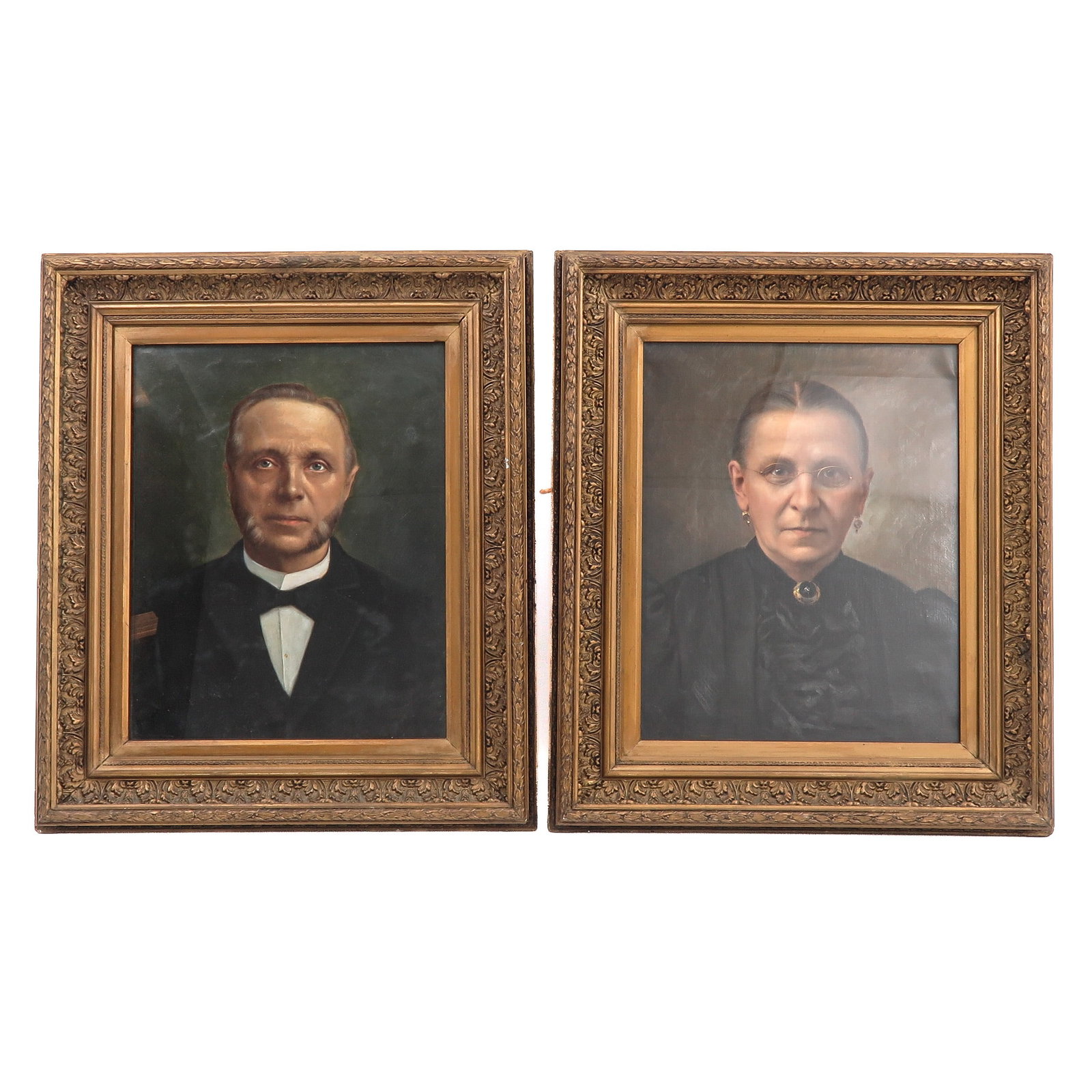 A Pair of Portrets: portraits, depicting a gentleman and a lady, in matching carved and gilt wooden frames, 50 x 60 cm.