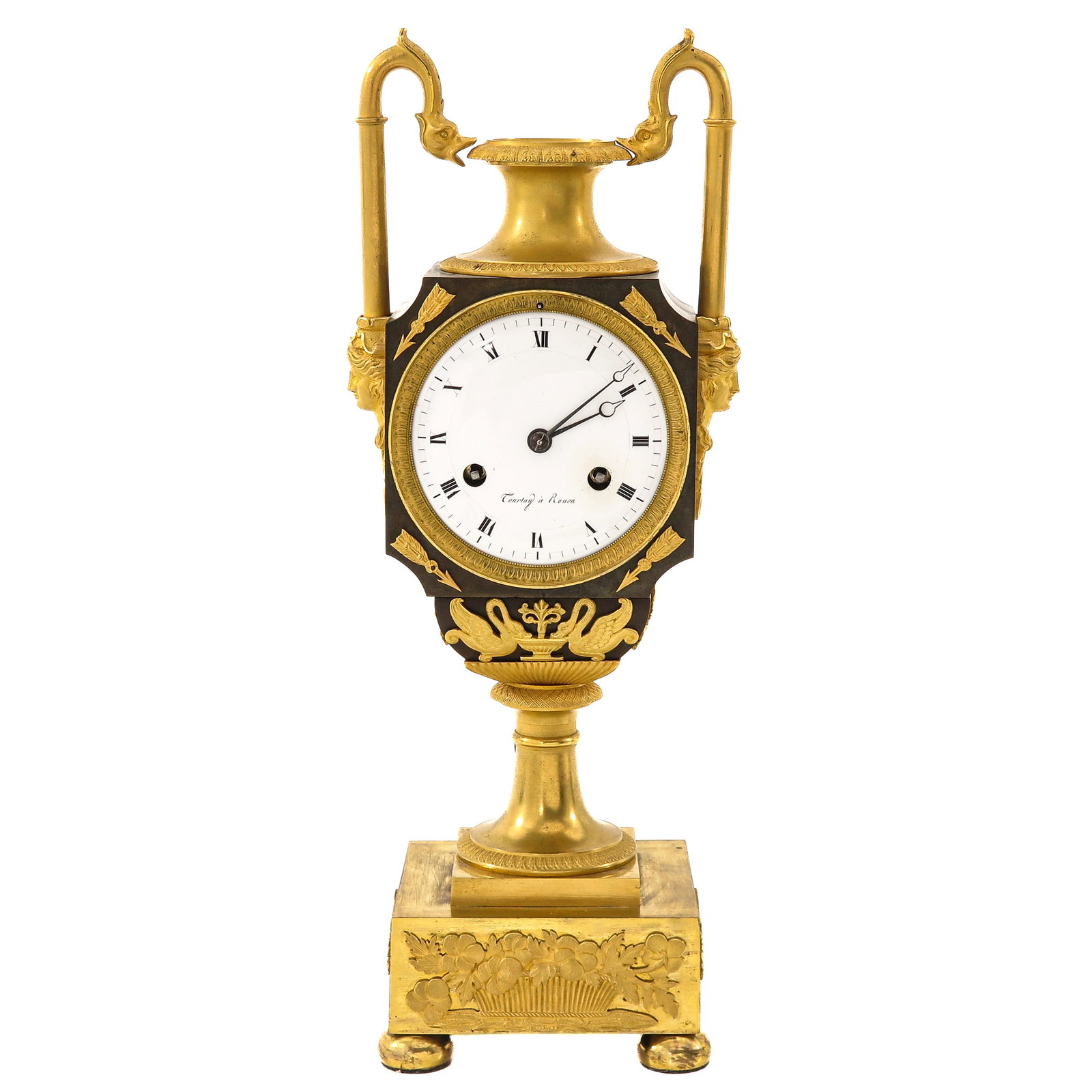A Mantel Clock: Empire period, ca. 1820, signed Courtay ? Rouen, gilt and patinated bronze, decorated with swans and classical ornaments, with thread suspension, height 40 cm.