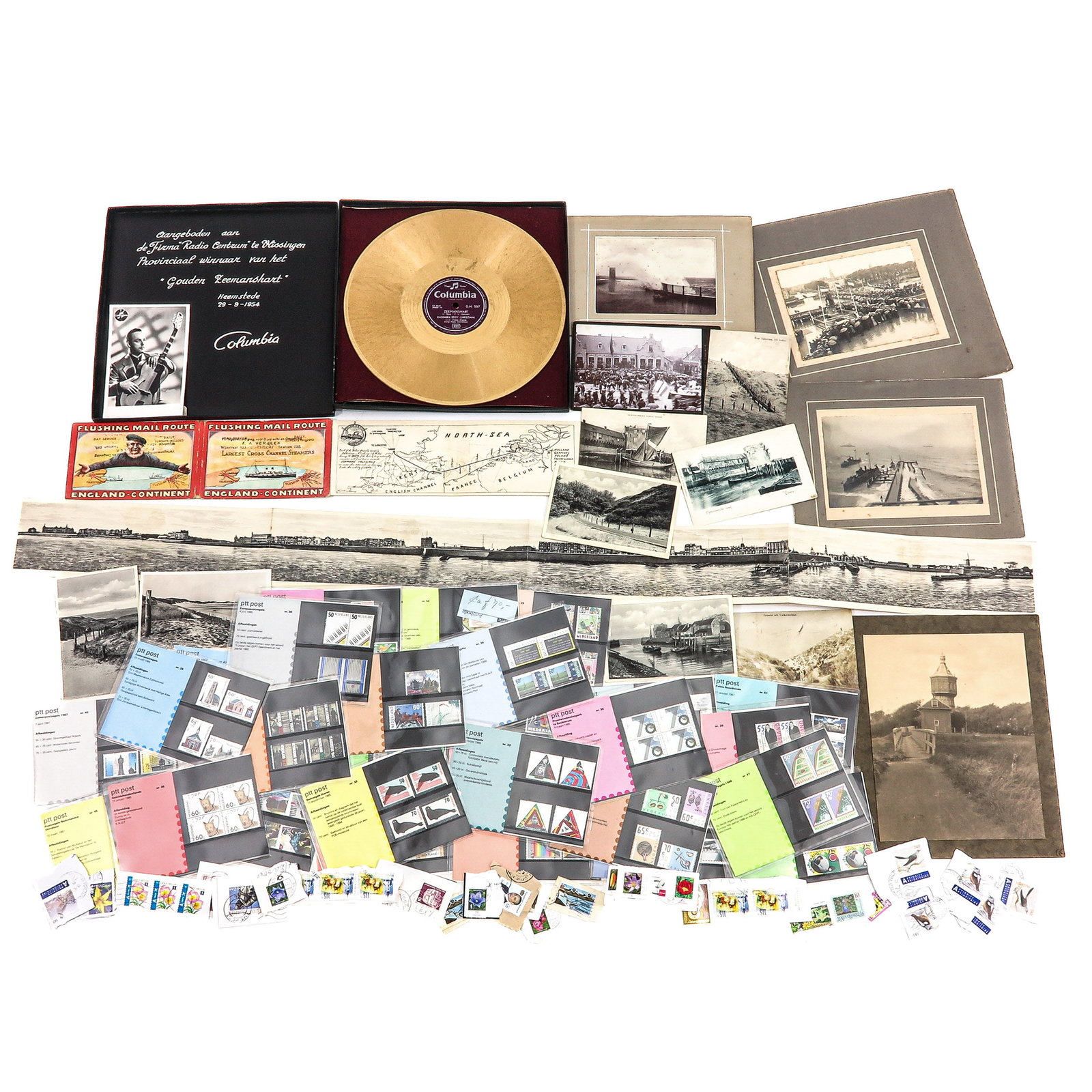 A Diverse Collection of Items: consisting of a varied collection of postcards, photographs and stamps, including the gold record titled Zeemanshart