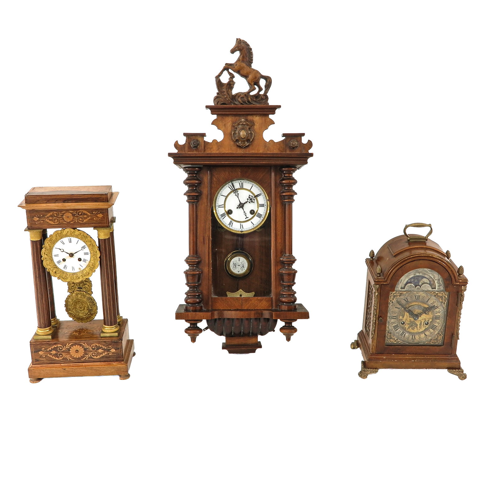 A Group of Clocks: consisting of 3 clocks, including an English table clock, signed John Taylor, London, tallest 79 cm.