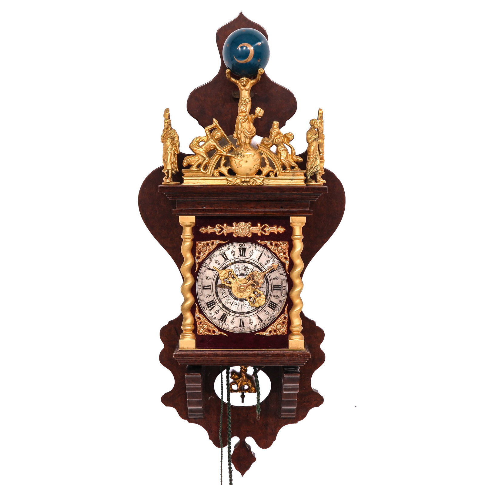 A Dutch Zaanse Wall Clock: walnut case with gilt columns, height 74 cm.