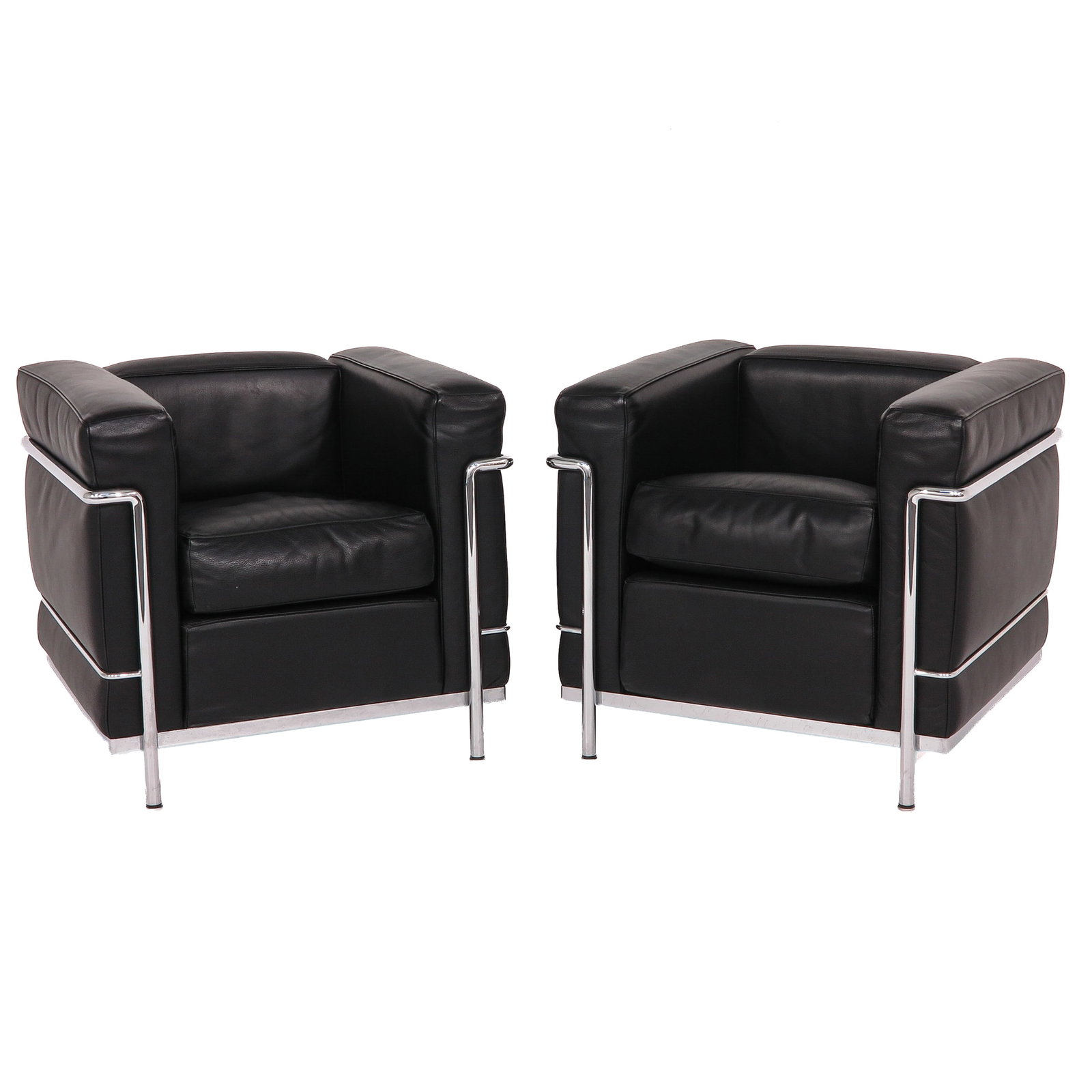 A Pair of Cassina LC2 Armchairs: Cassina LC2 armchairs, Le Corbusier, black leather with a chrome frame, height 68 cm.