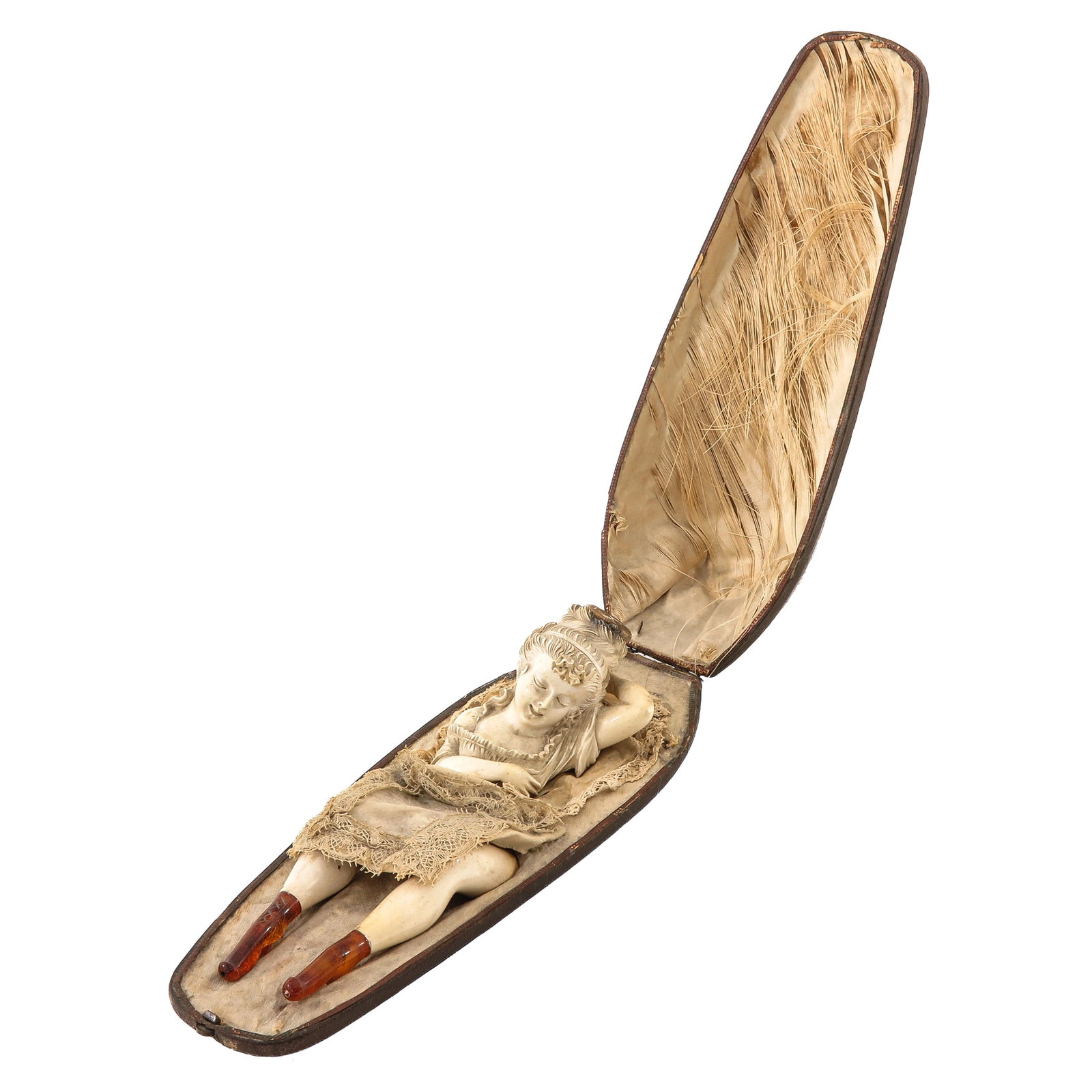 A Meerschaum Pipe: rare, in the form of a woman lying in a bed, in case whereby her legs form two cheroot pipe holders, 3 pipes in total, length case 24 cm.