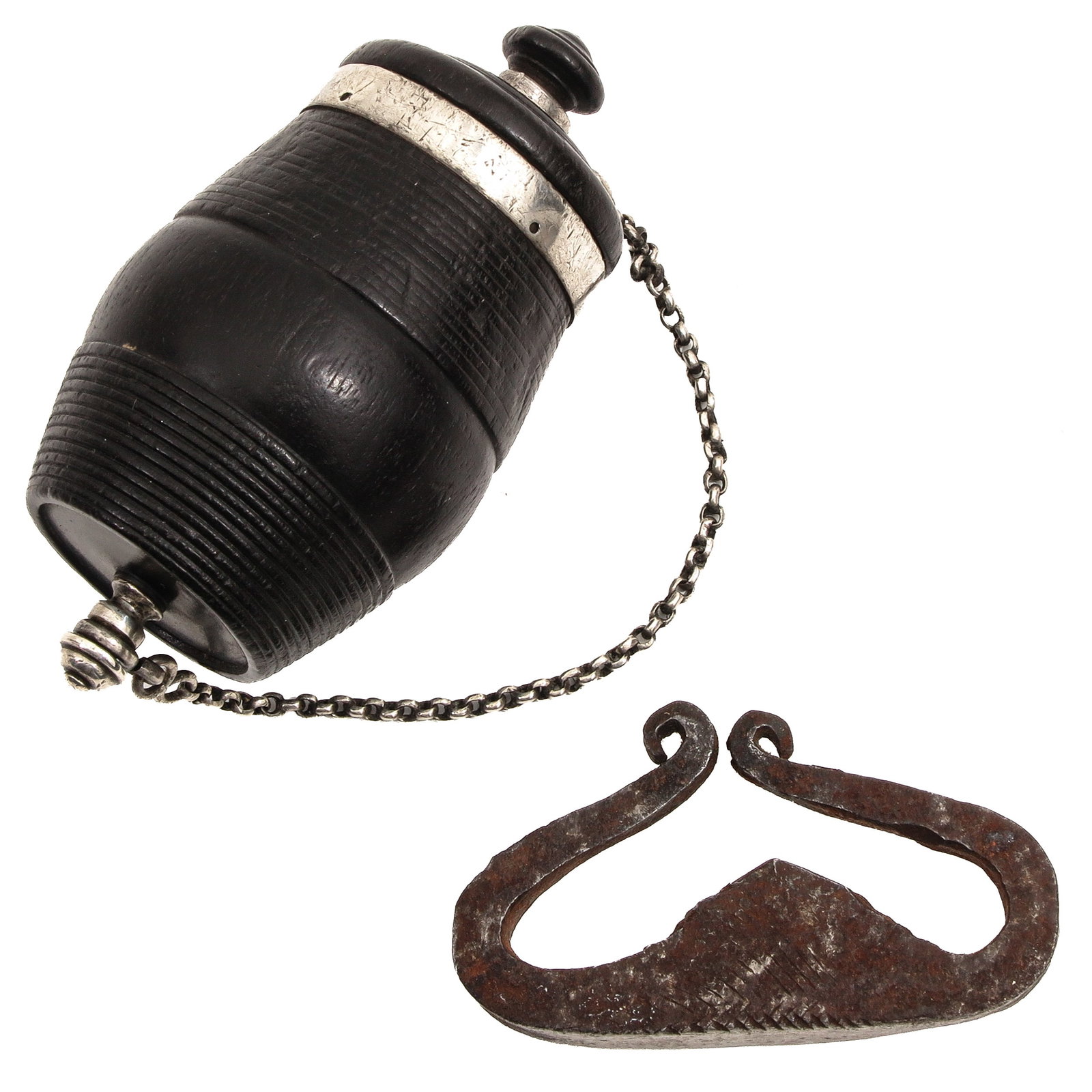 A Tinder Box: fitted with a chain and fire steel, length 8,5 cm.