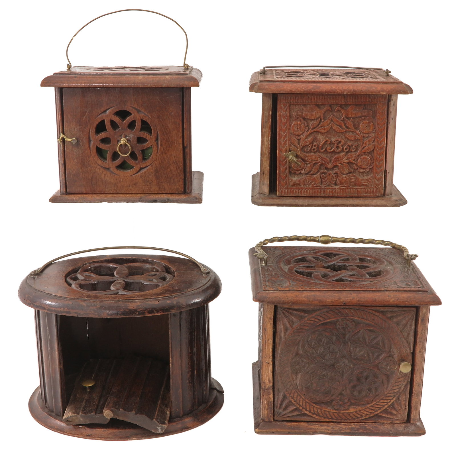 A Group of Carved Wood Foot Warmers: consisting of 4 antique wooden church foot warmers, various designs, largest 24 x 19 x 35 cm., including handle